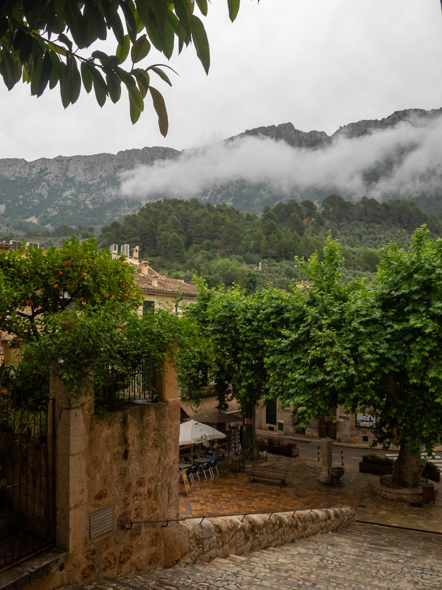 Cobbled streets and stone houses below Tramuntana mountains in Fornalutx