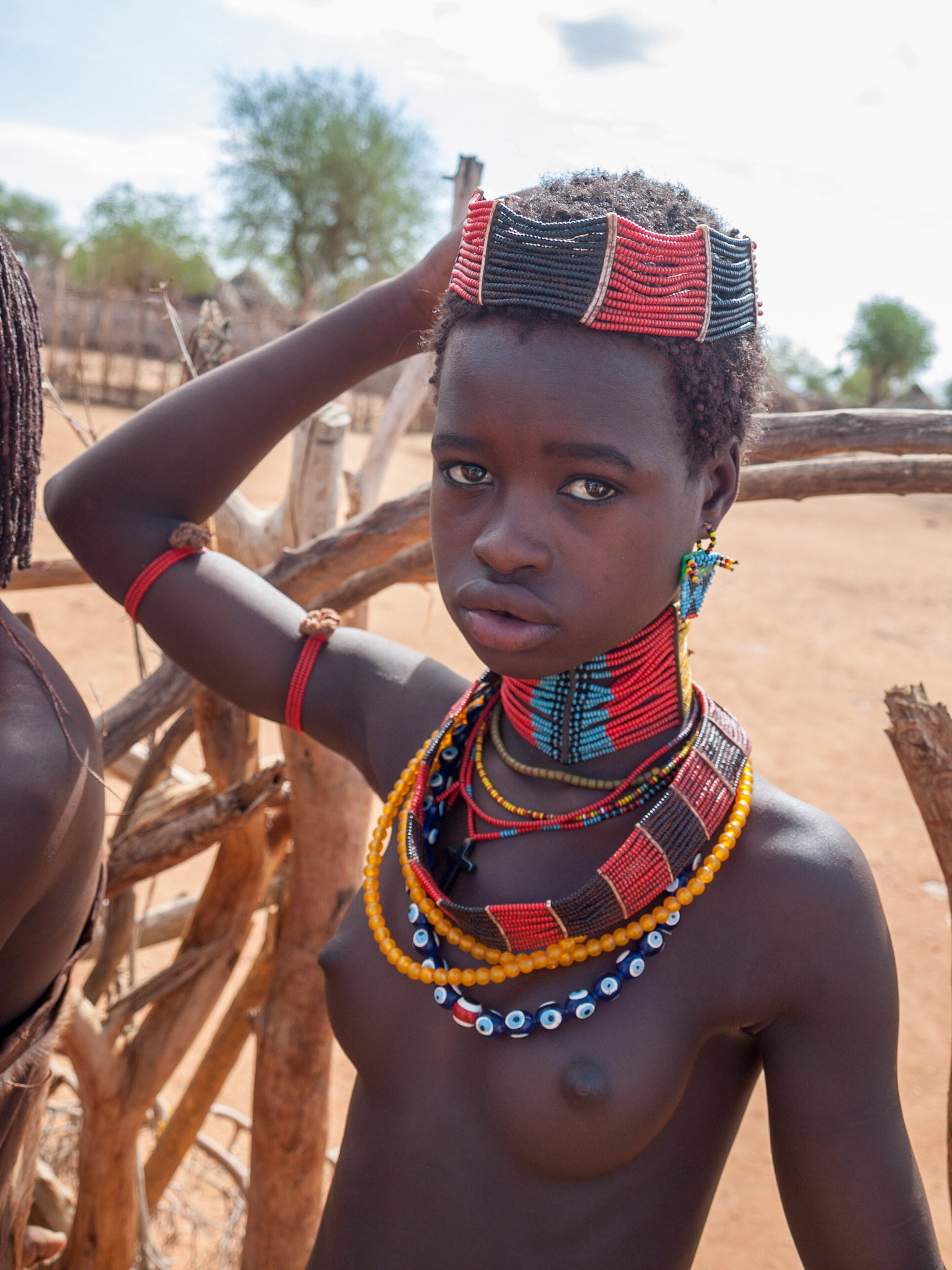 Hamer teenage girl in traditional beads jewelry