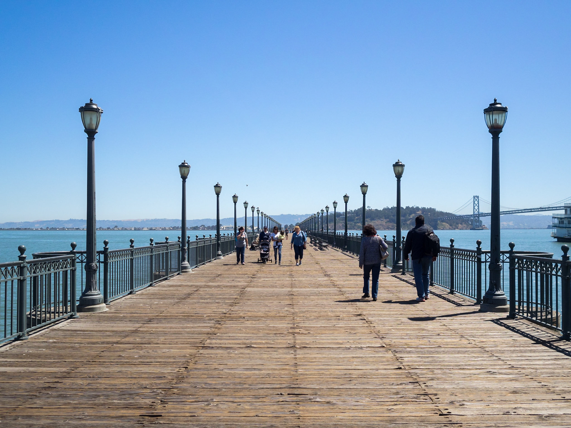 People walking along San Francisco port pier