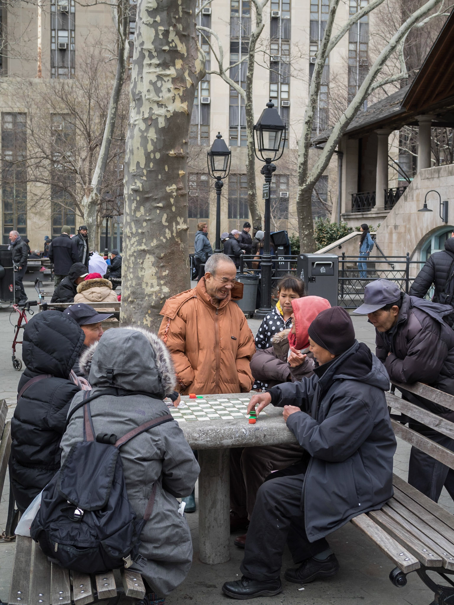 Chinese playing board games in the park in Manhattan Chinatown
