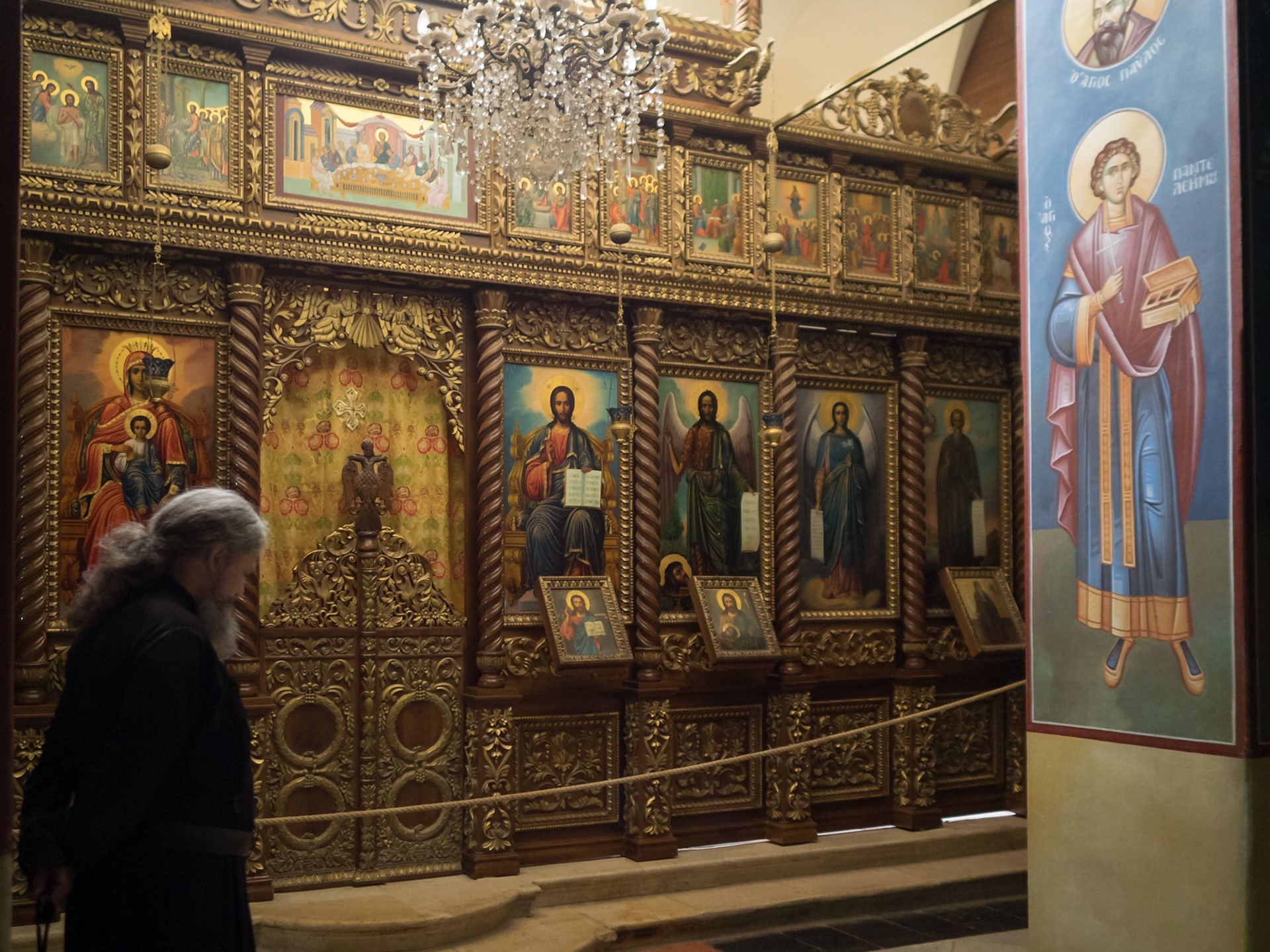 Priest inside the Greek Orthodox Church of the Monastery of Temptation