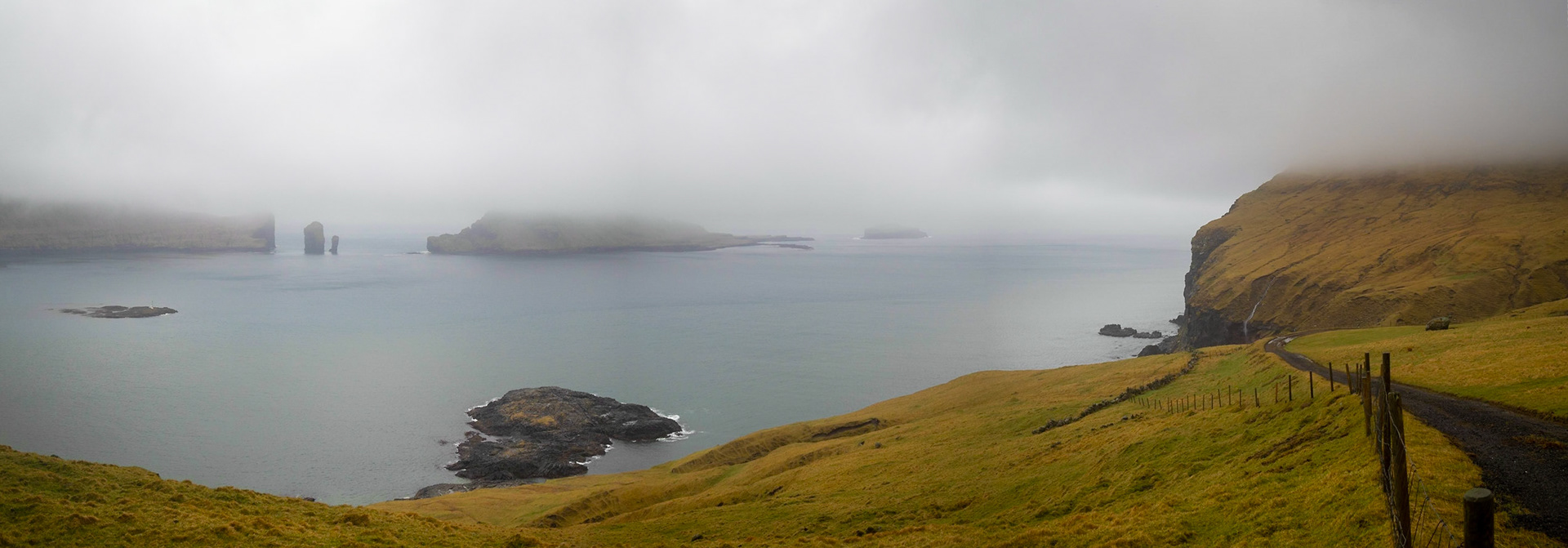 Gáshólmur islet and Tindhólmur under low clouds seen from Vágar island
