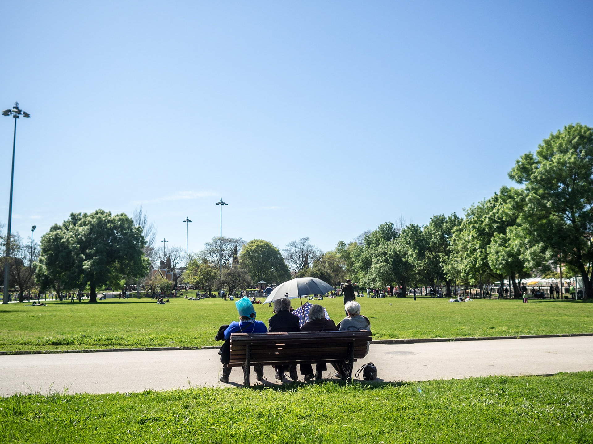 Elder people seated in Belem garden