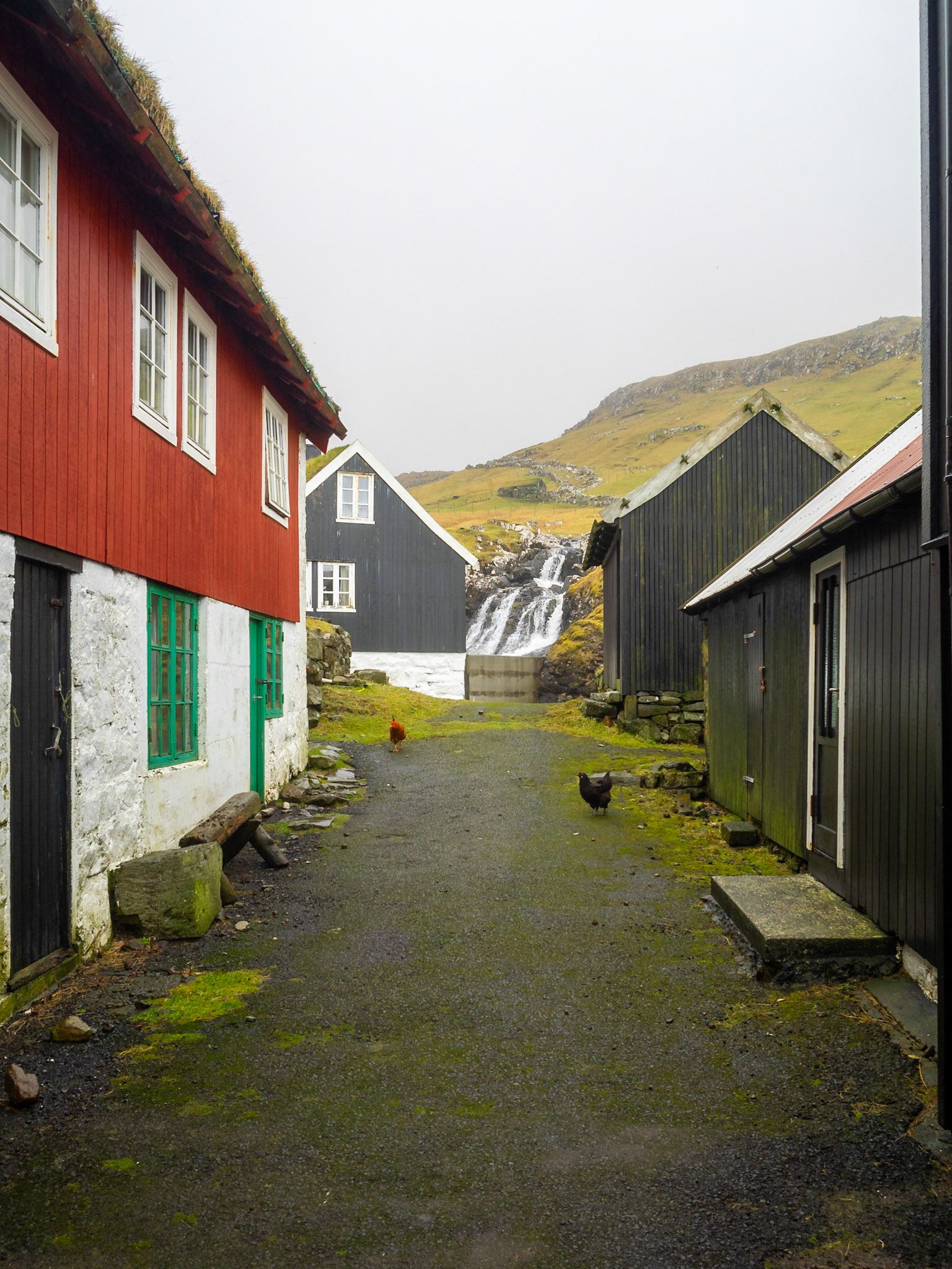 Mykines street with a waterfall at th end