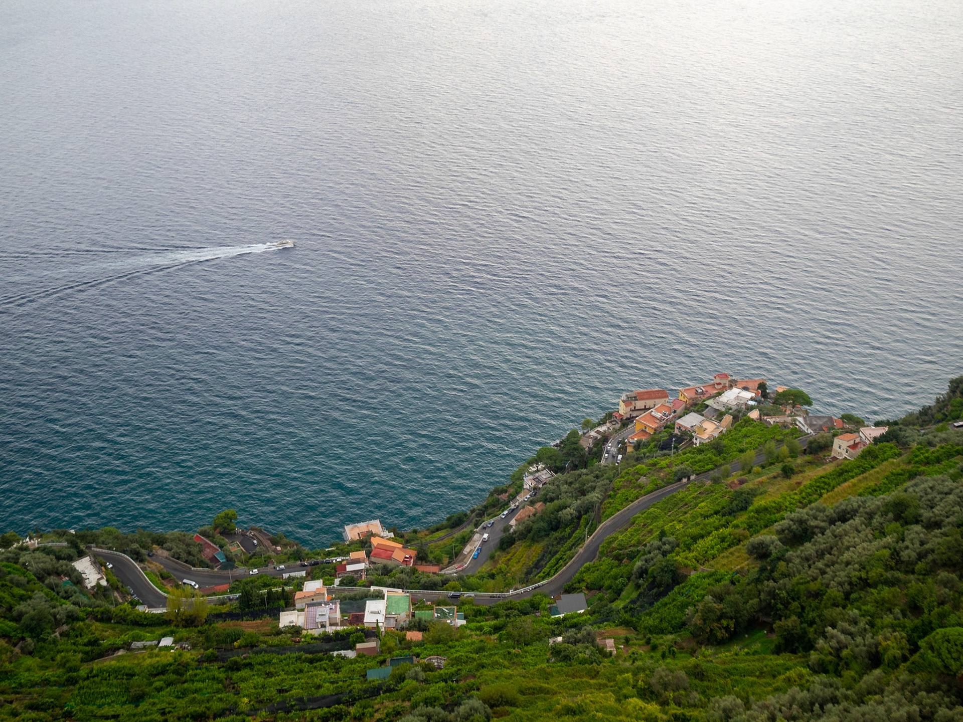 Winding road over the sea of the green slops of Amalfi Coast, seen from the Terrazza dell'lnfinito, Villa Cimbrone