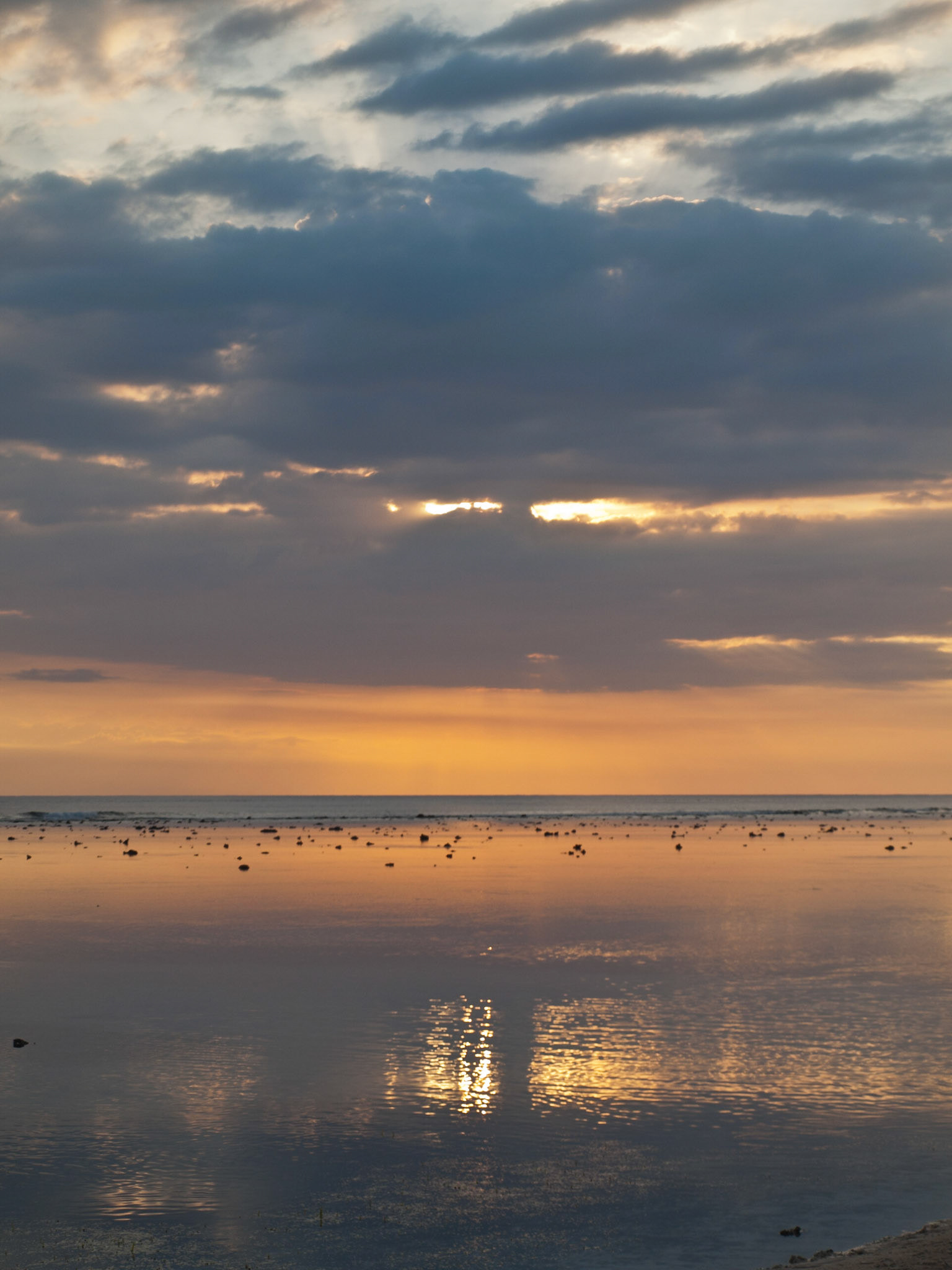 Sunset reflection in the coral reef sea in Gili Trawangan