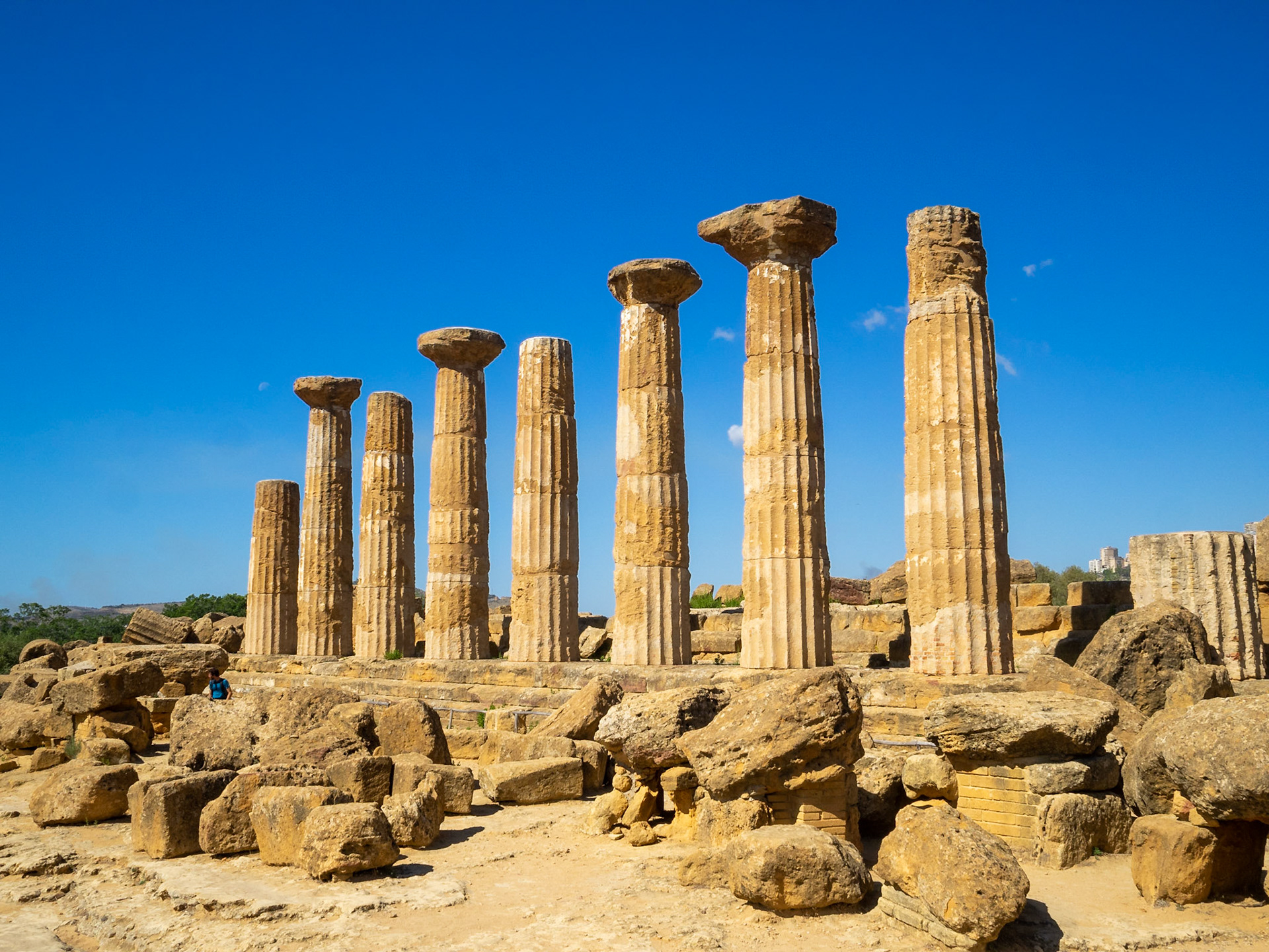Doric Order columns standing by other remains of the Temple of Heracles in Valle dei Templi