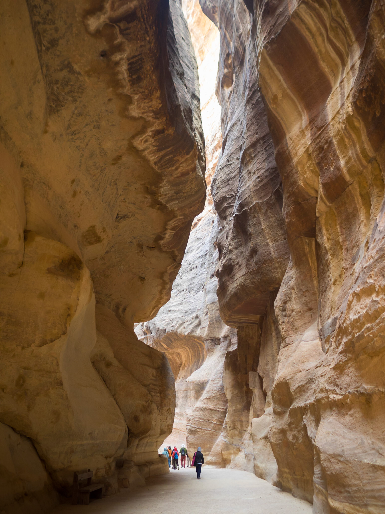 People looking small in Petra Siq