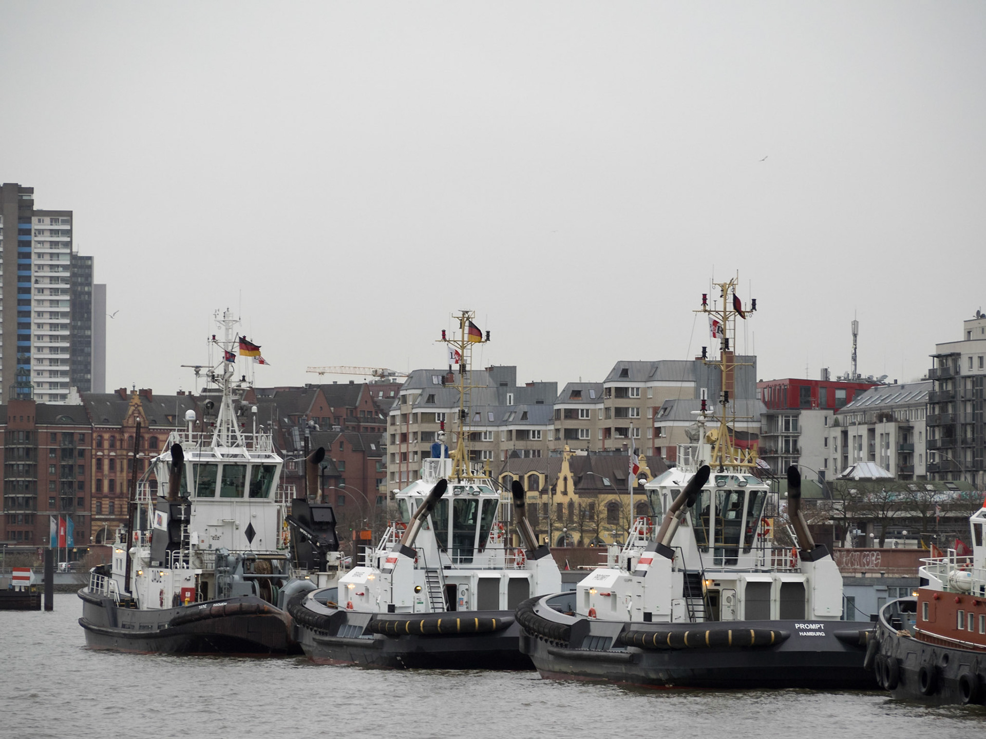Hamburg port docked tugs