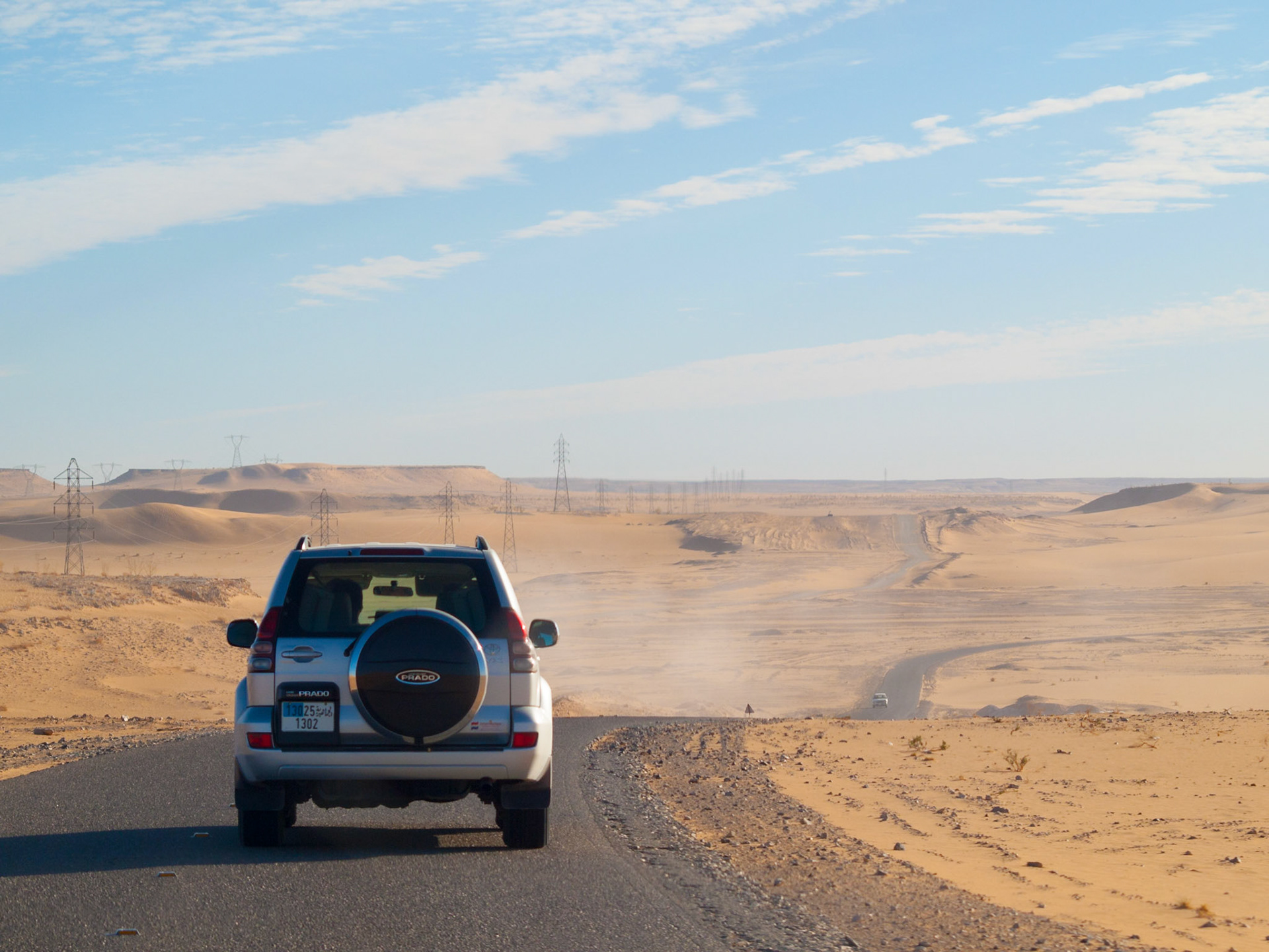 4x4 car in a road in the Libyan desert