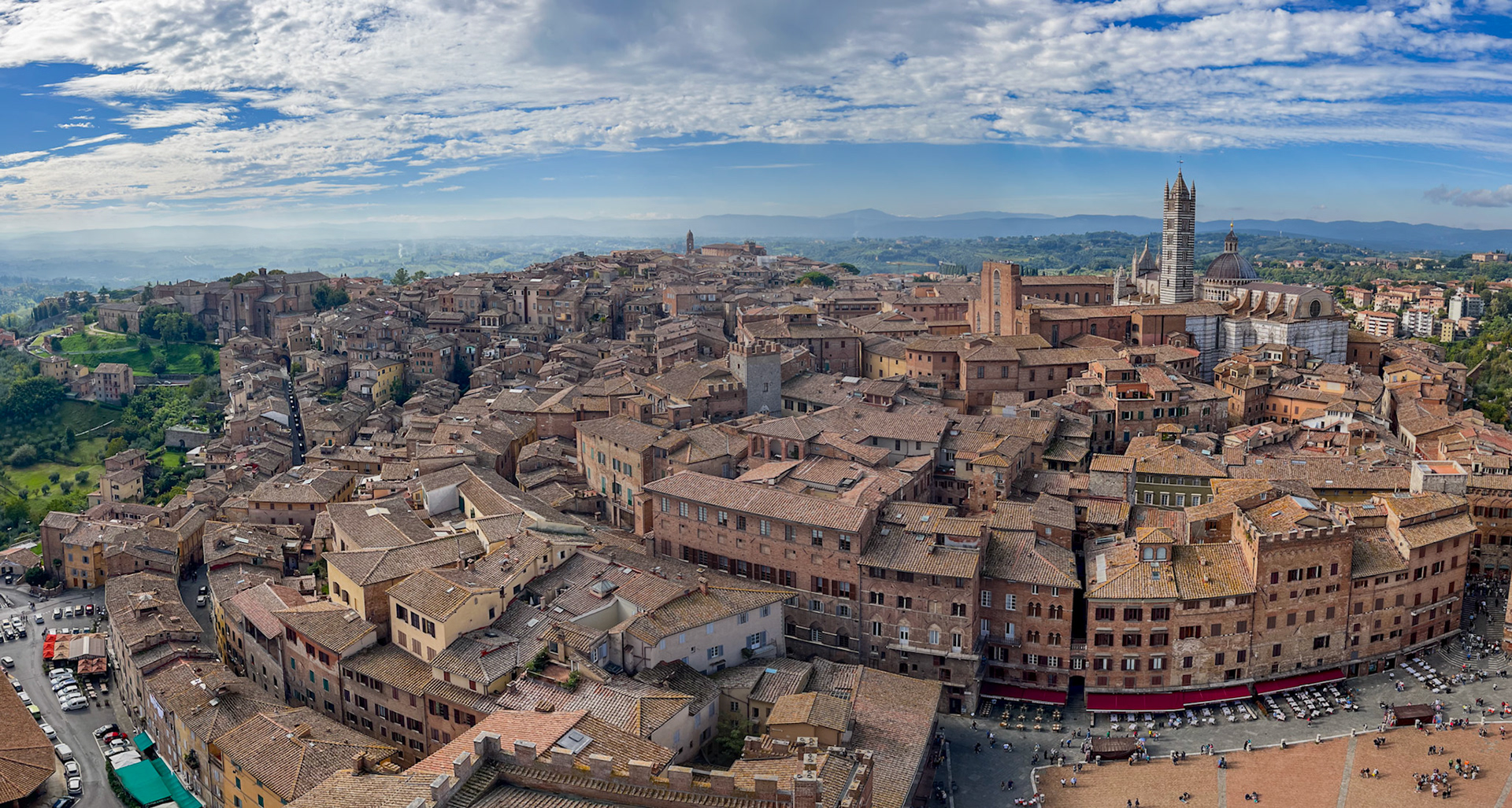 Siena Duomo with the countryside in background and Piazza del Campo