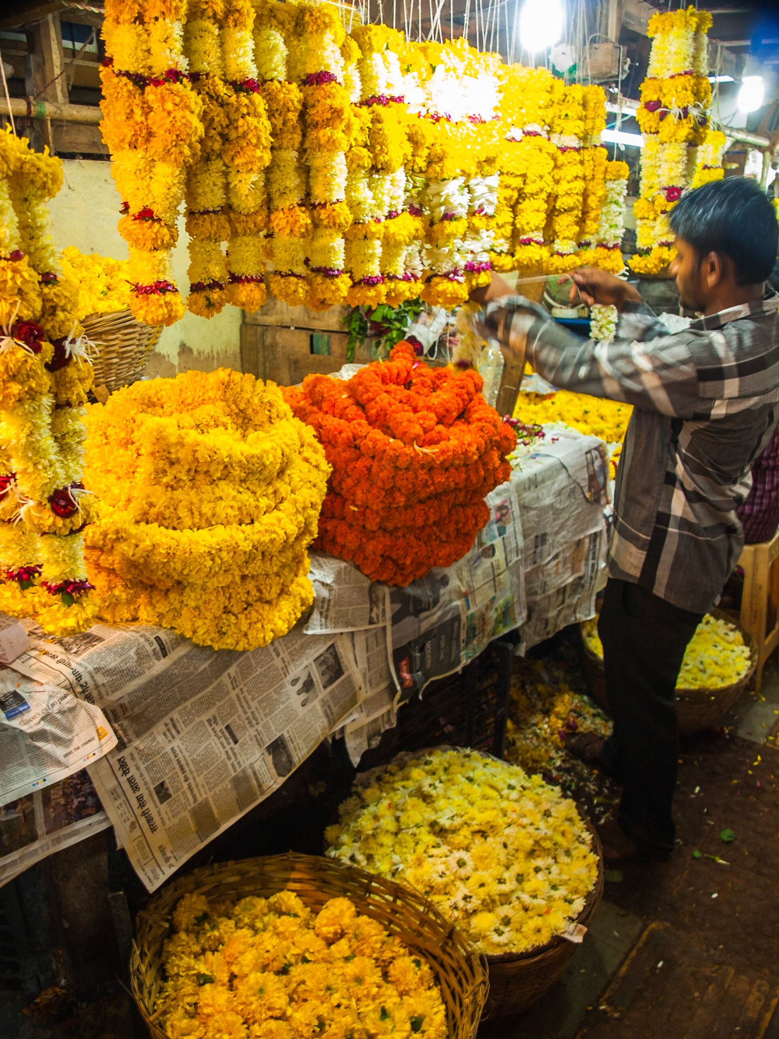 Selling flowers in Panaji market