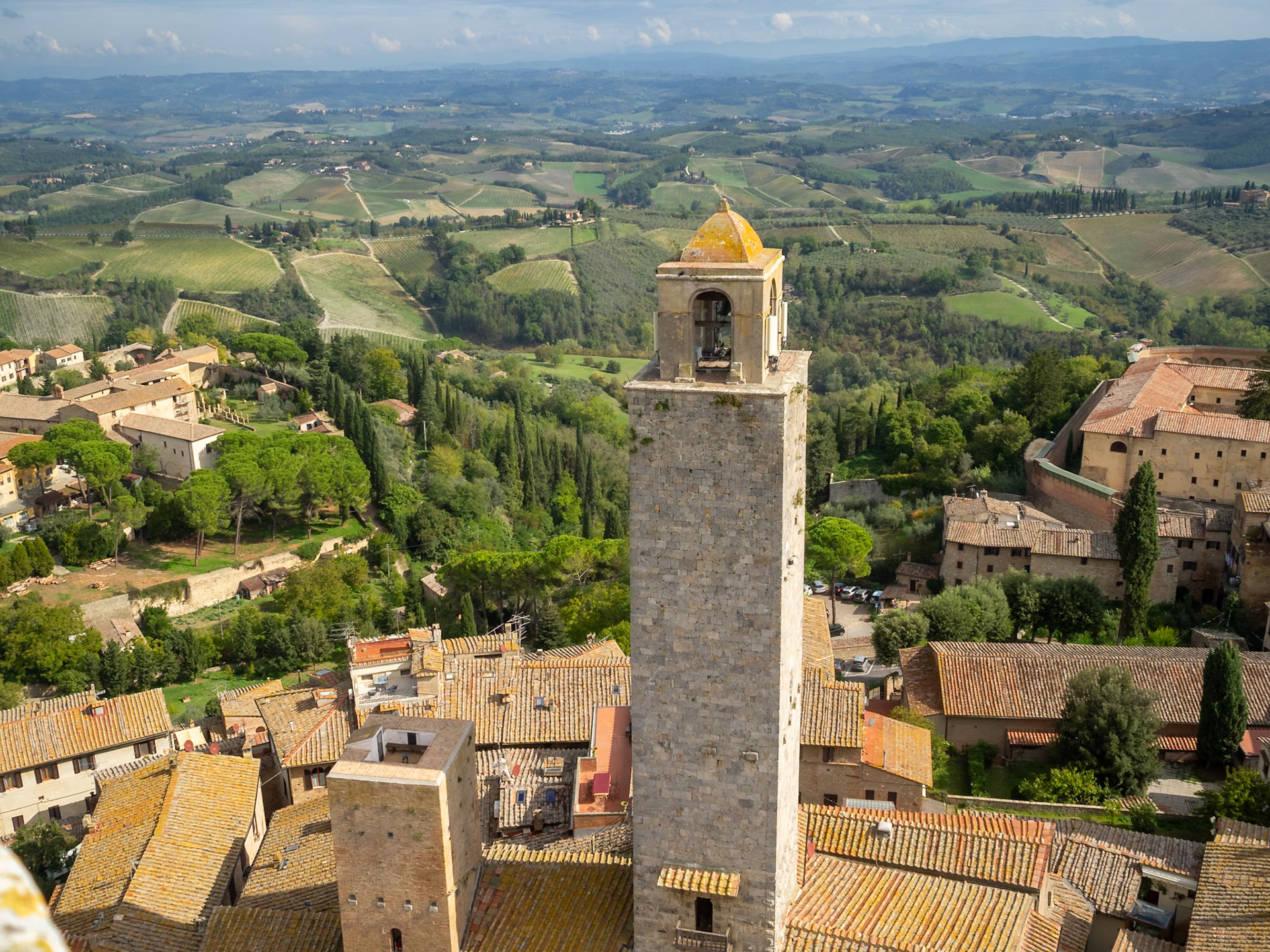 San Gimignano roof tops and medieval towers above the Tuscan ladnscape