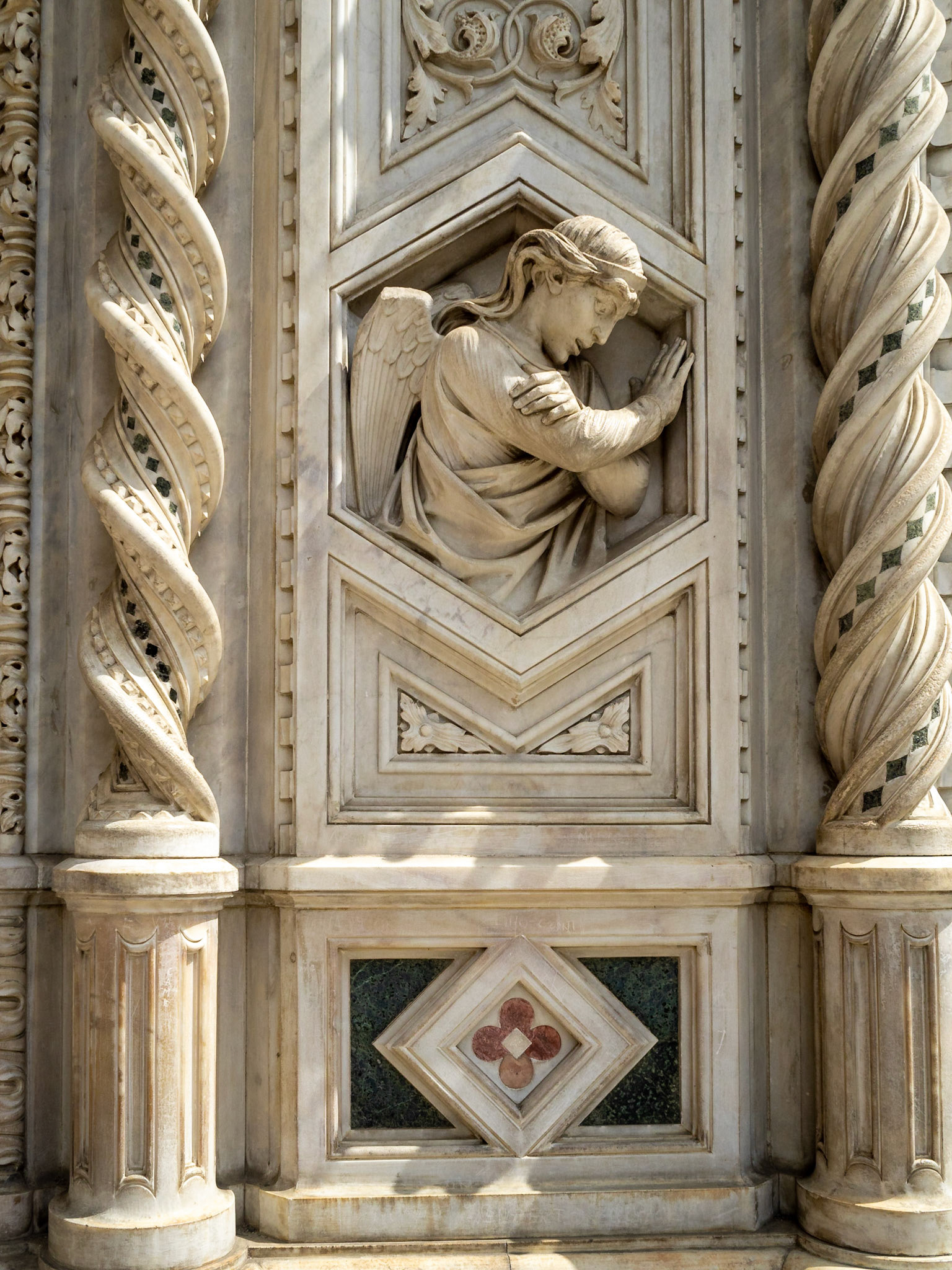 Angel image stone carving on the facade of Florence Duomo