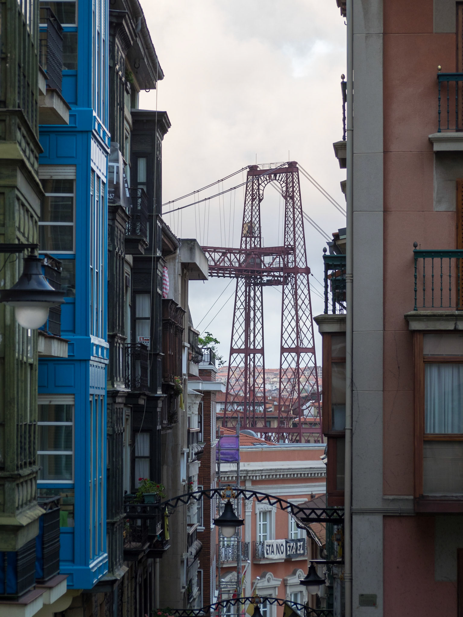 View of Vizcaya Bridge between Portugalete street buildings
