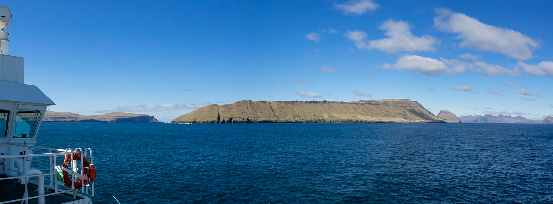 Left to right, Sandoy, Hestur and Koltur islands seen from the ferrie crossing of Skopunarfjørður