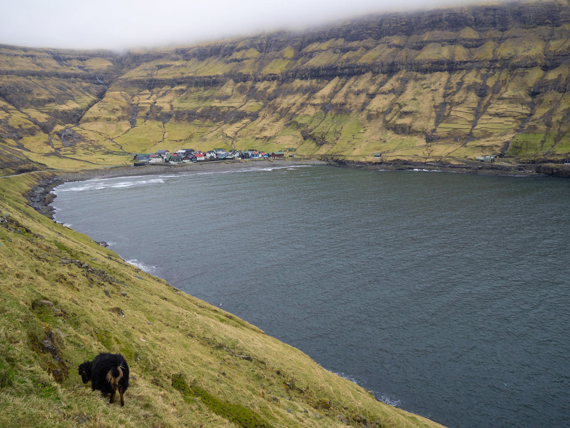 Tjørnuvík hamlet seen from the road down the mountain