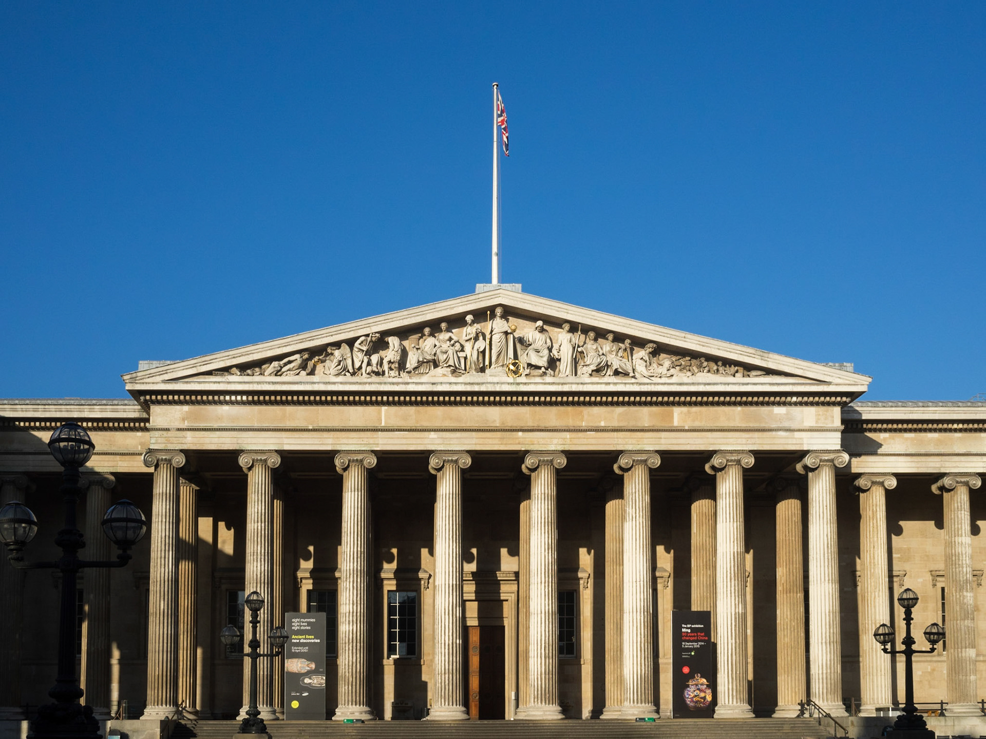 British museum main entrance facade with blue sky background
