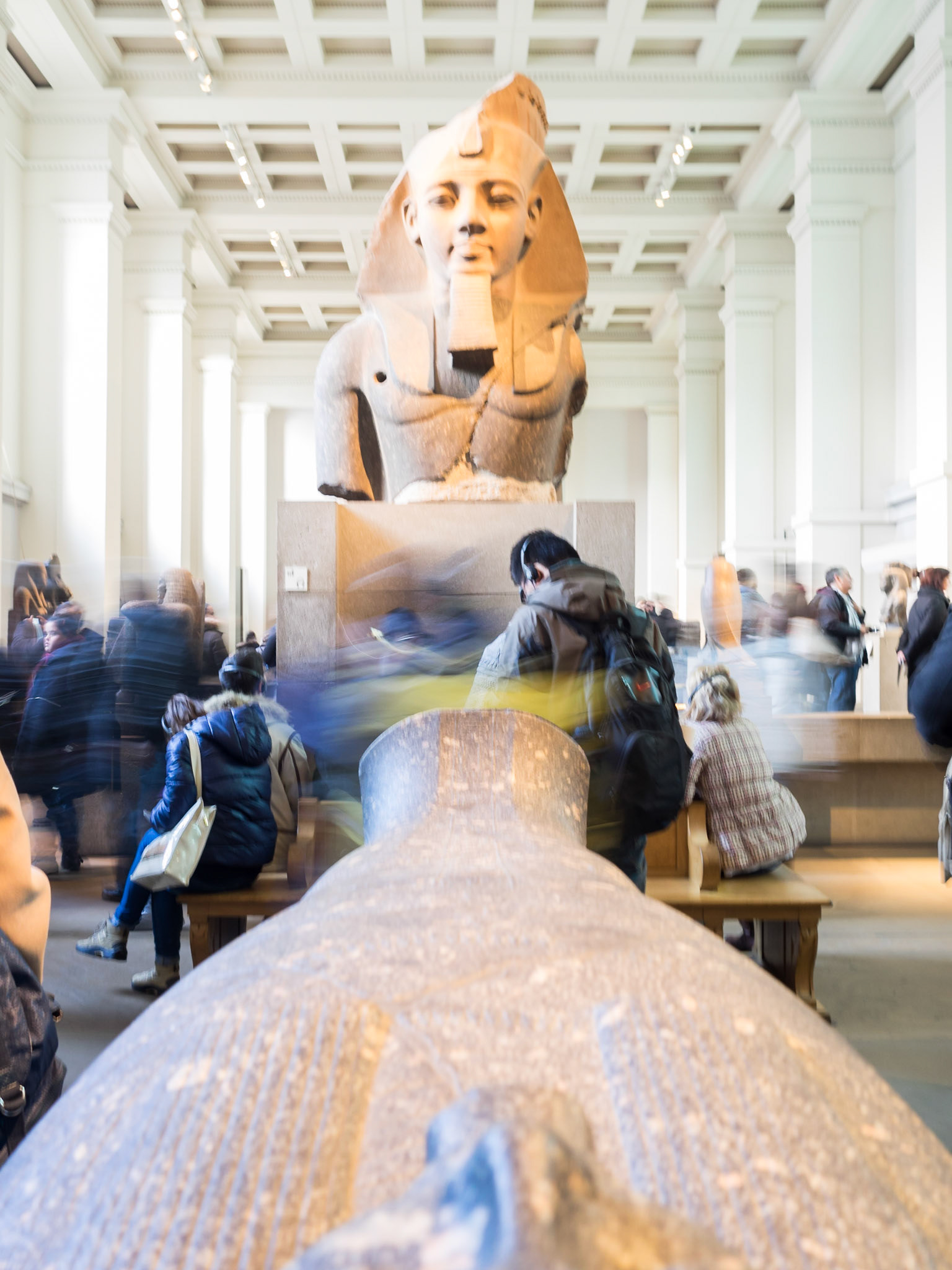 Visitors at the Egyptian statues room of the British Museum