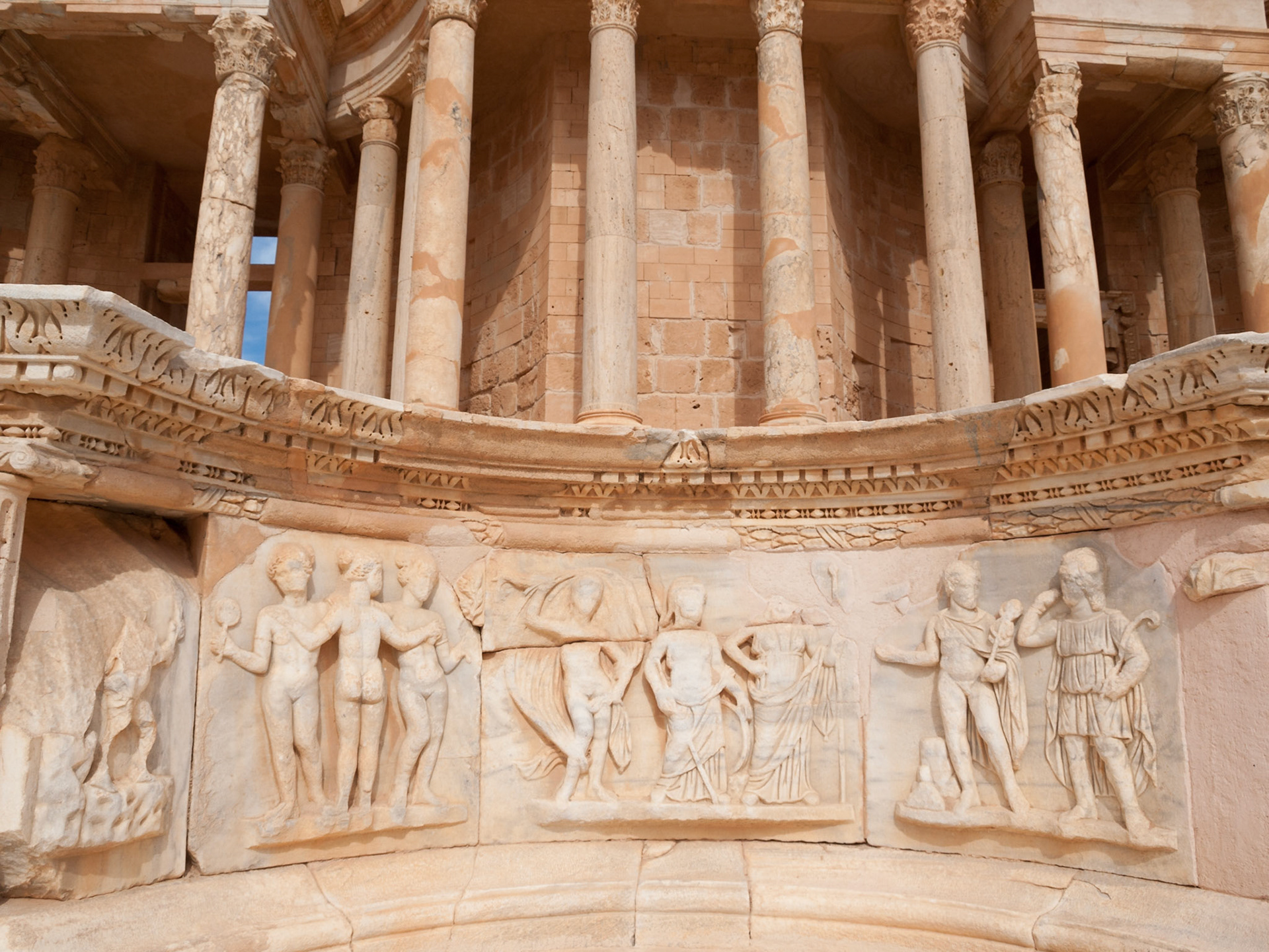 Roman ruins of Sabratha theater stage detail with the Three Graces and Judgment of Paris
