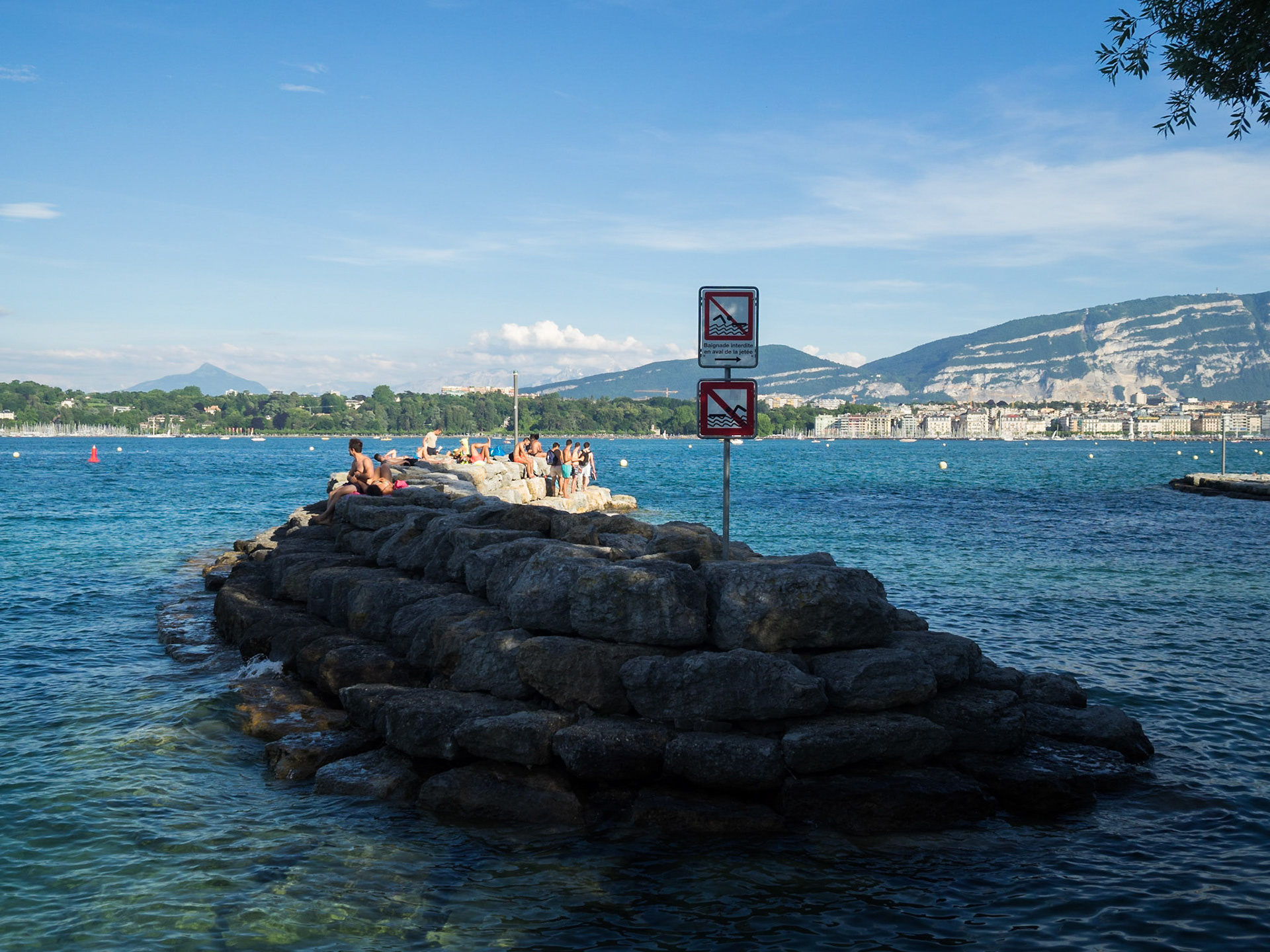 People in the sun in Lake Geneva