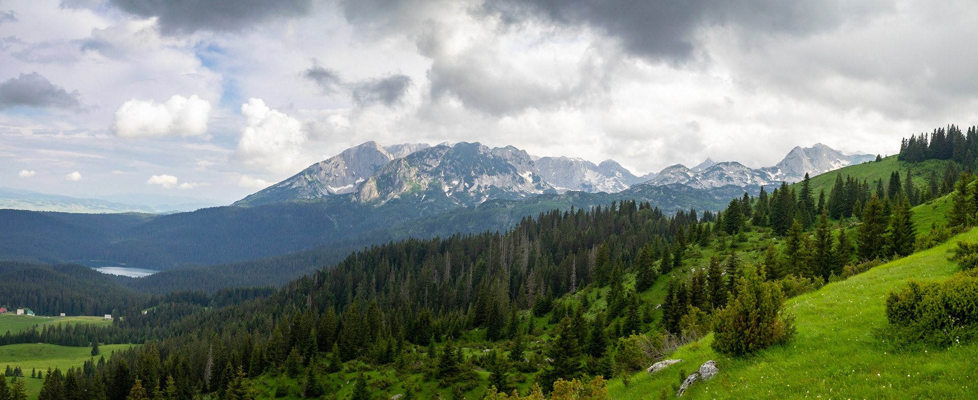 Black Lake between the dark pine forest and below Bear Mountain, Durmitor
