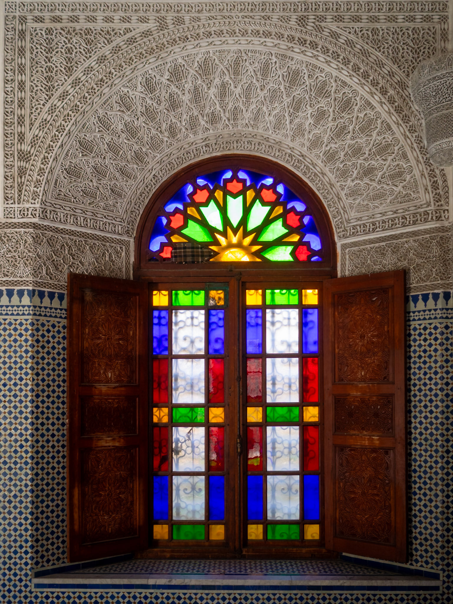 Dar Glaoui room window framed by zellij and islamic stucco, Fez, Morocco