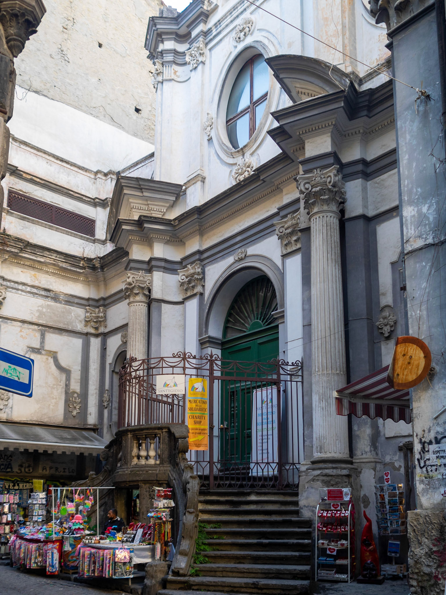 Souvenir shop under San Nicola a Nilo church doorway, Naples