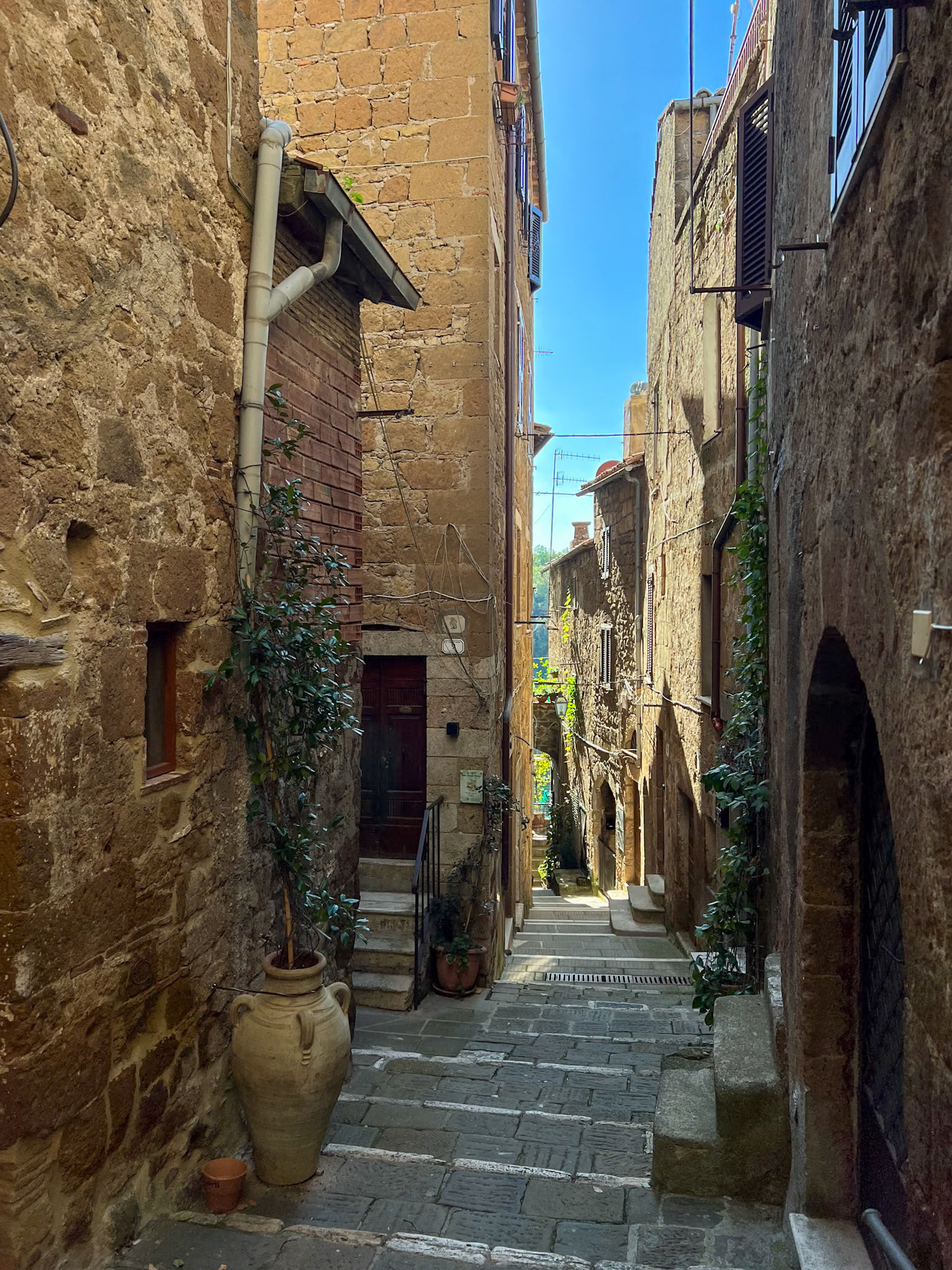 Narrow Pitigliano street with steps