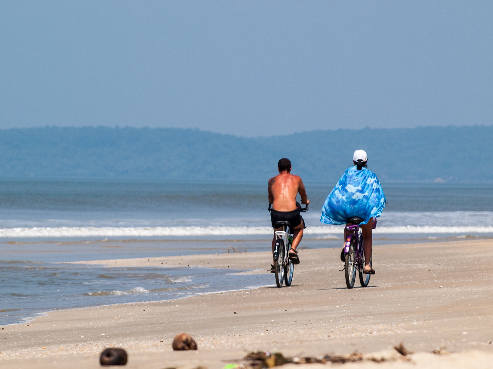 A couple cycles along Betalbatim beach in Goa