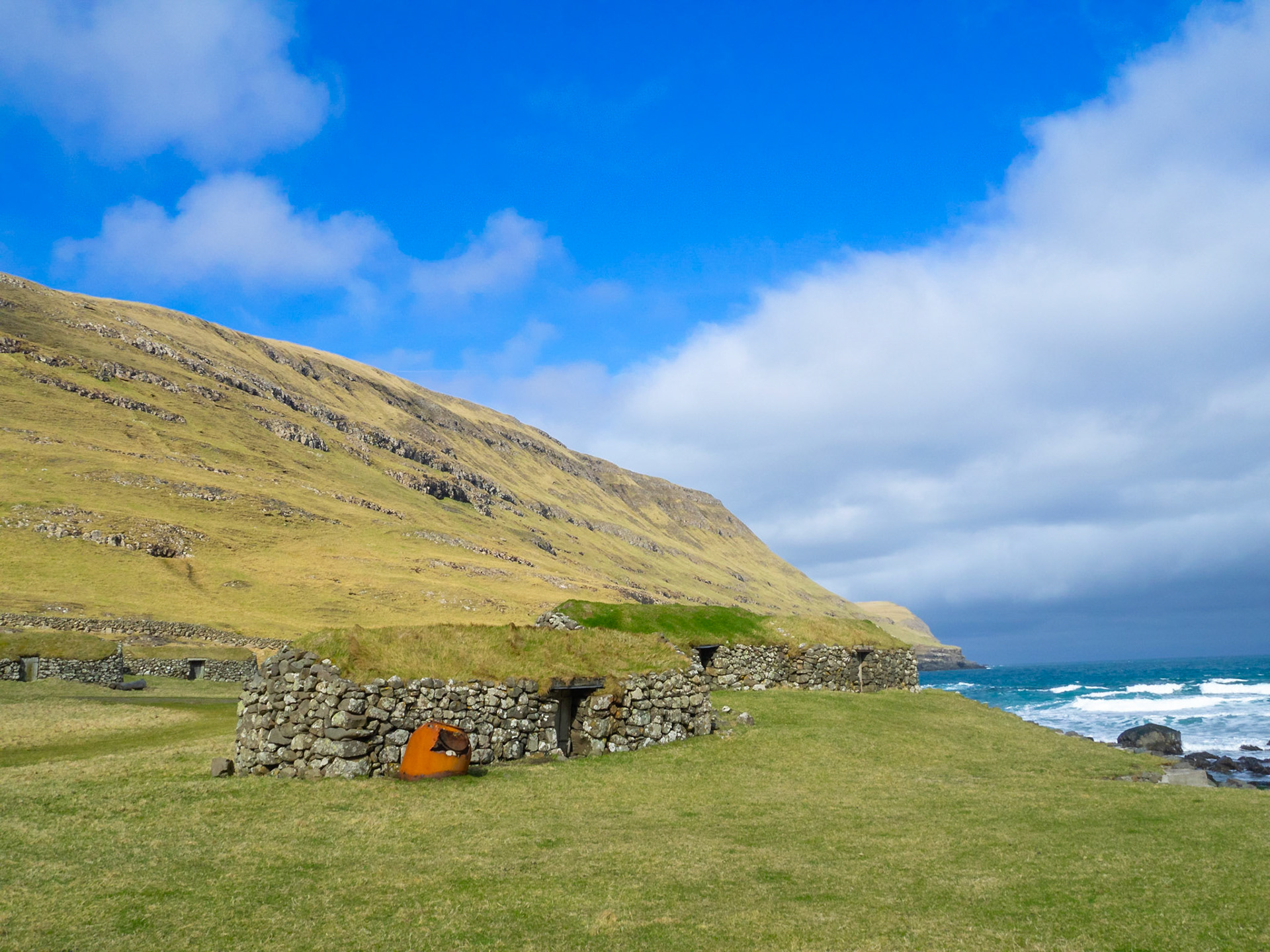 Húsavík old medieval farm turf roofed stone houses by the sea