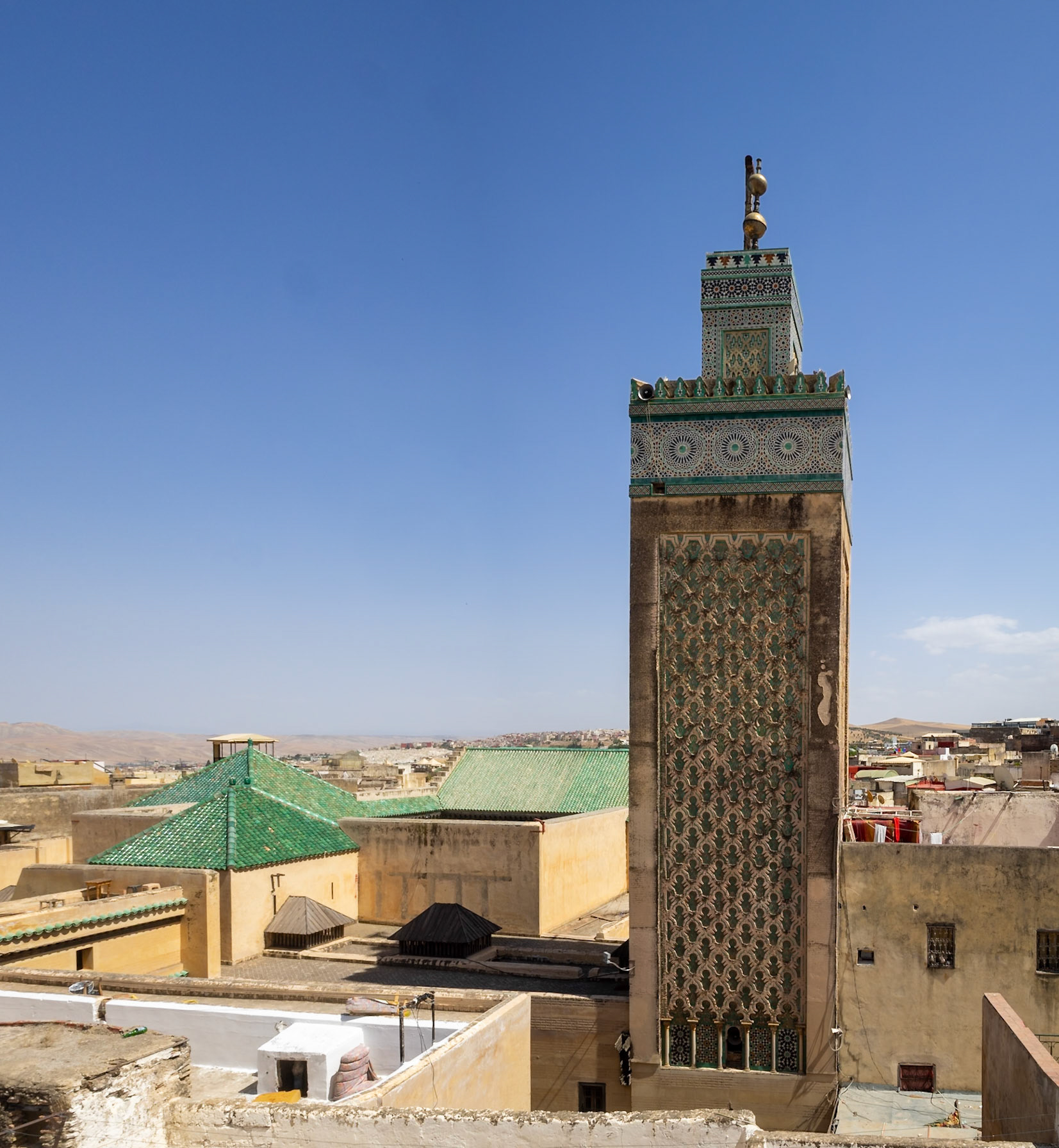 Bou Inania Madrasa minaret over Fez roofs, Morocco