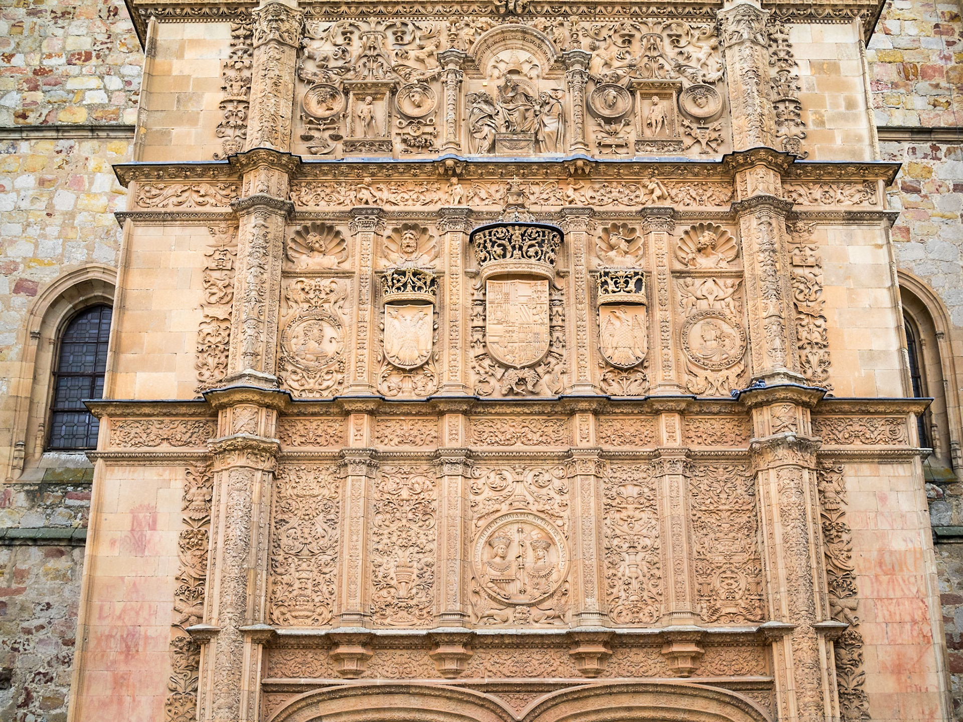 Detail of the stone carved facade above the doorway to the Esculeas Mayores of Salamanca University