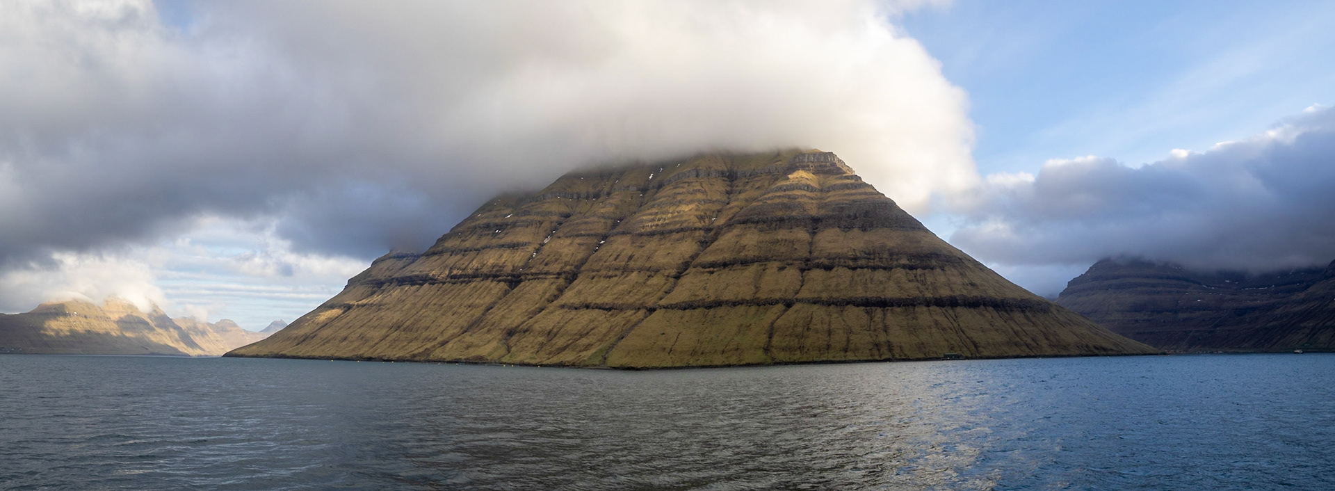 Panorama of the south of Kunoy island with low clouds