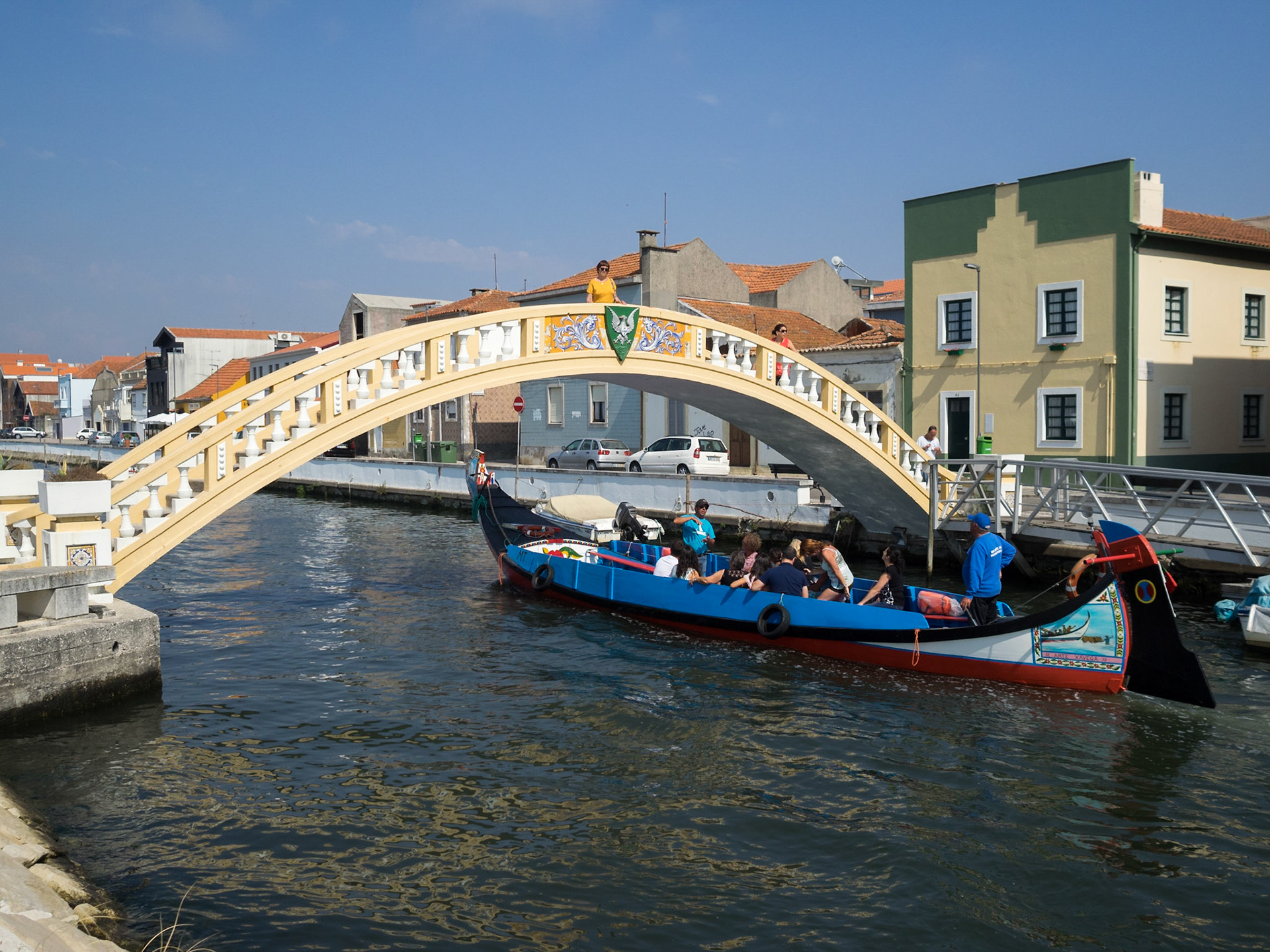 Tourists travelling the Aveiro canals in a typical moliceiro boat