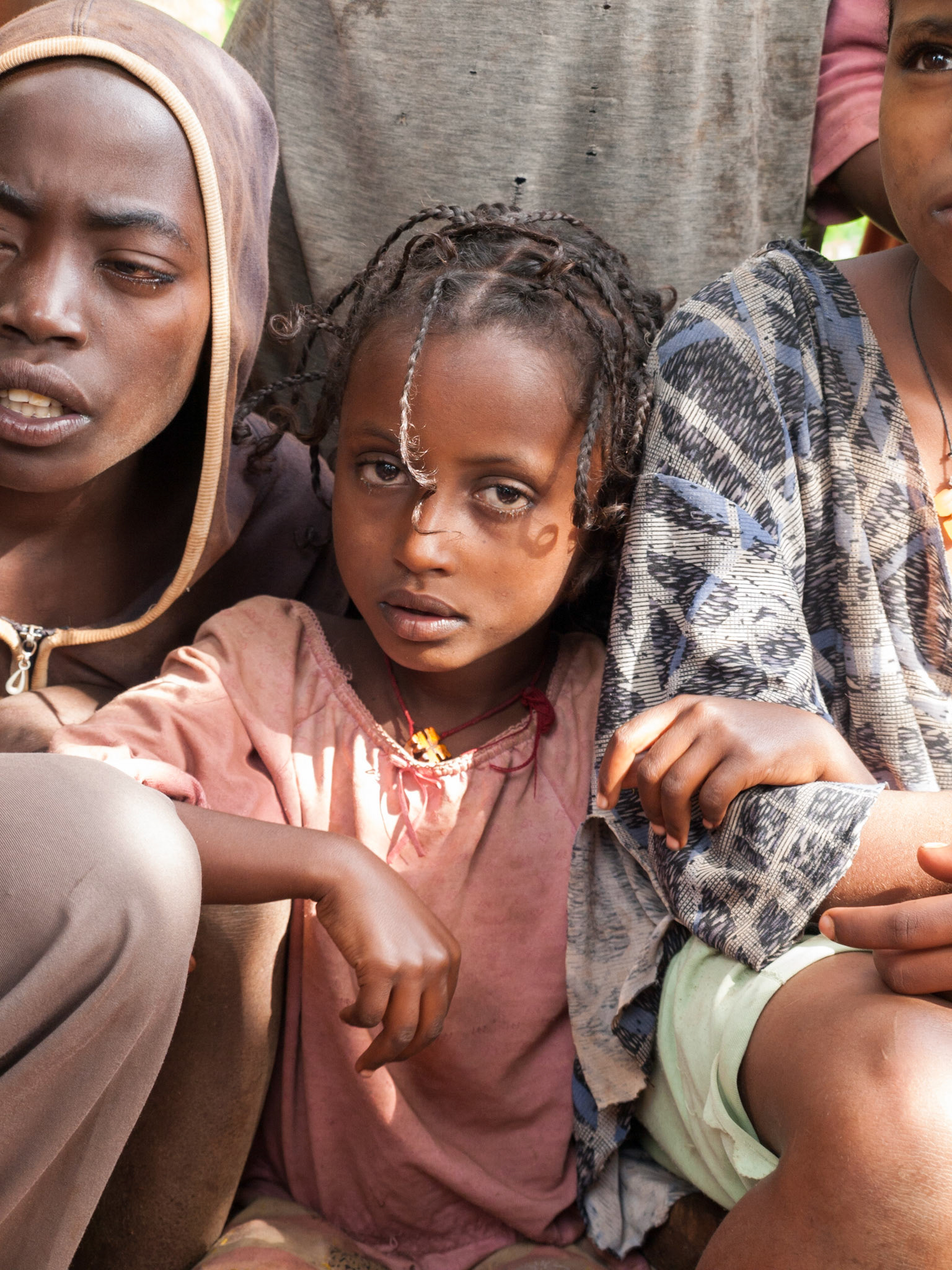 Ethiopian girl with beautiful sad eyes look at camera