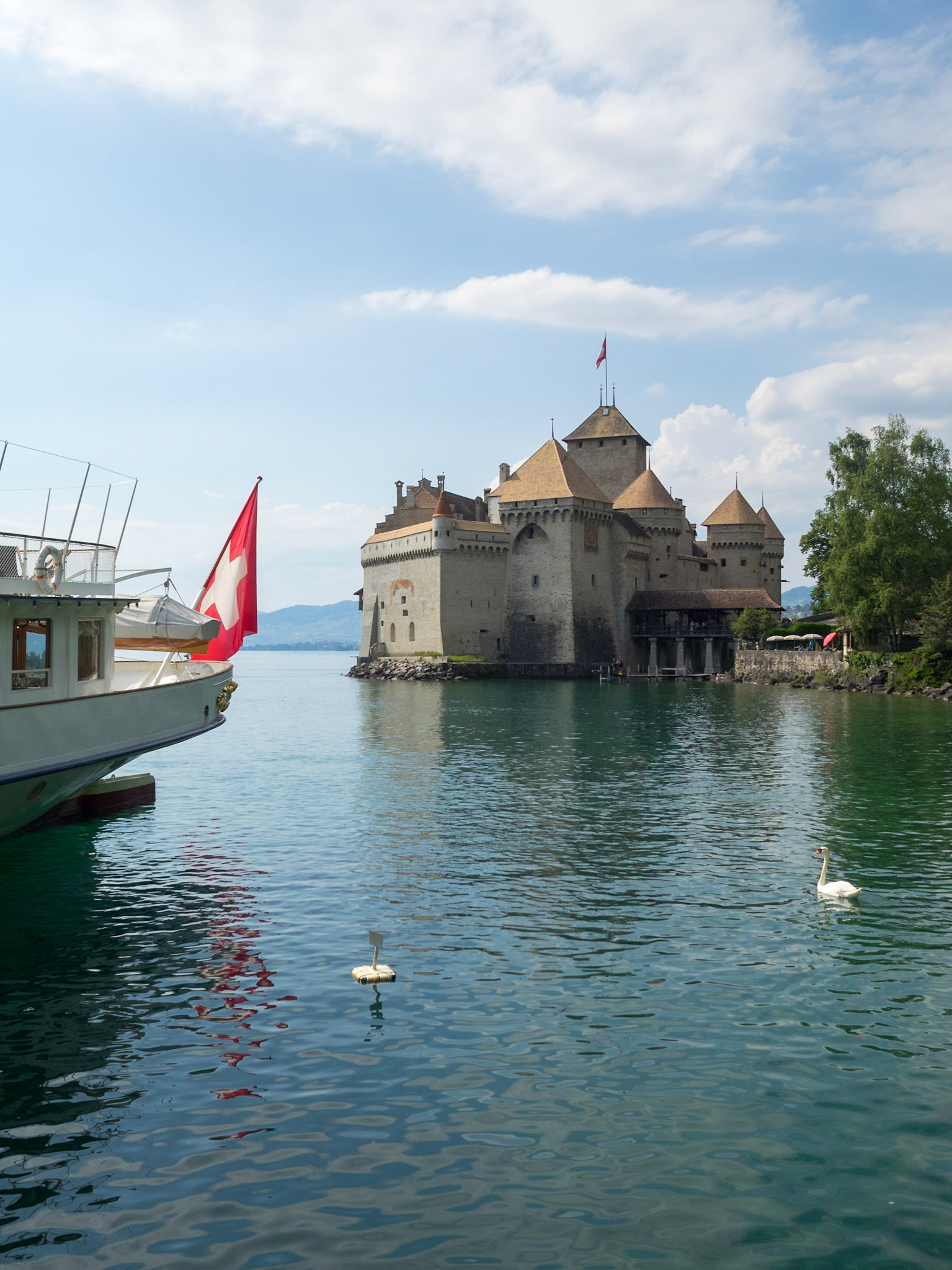 Steamboat with Switzerland flag by Chateau de Chillon