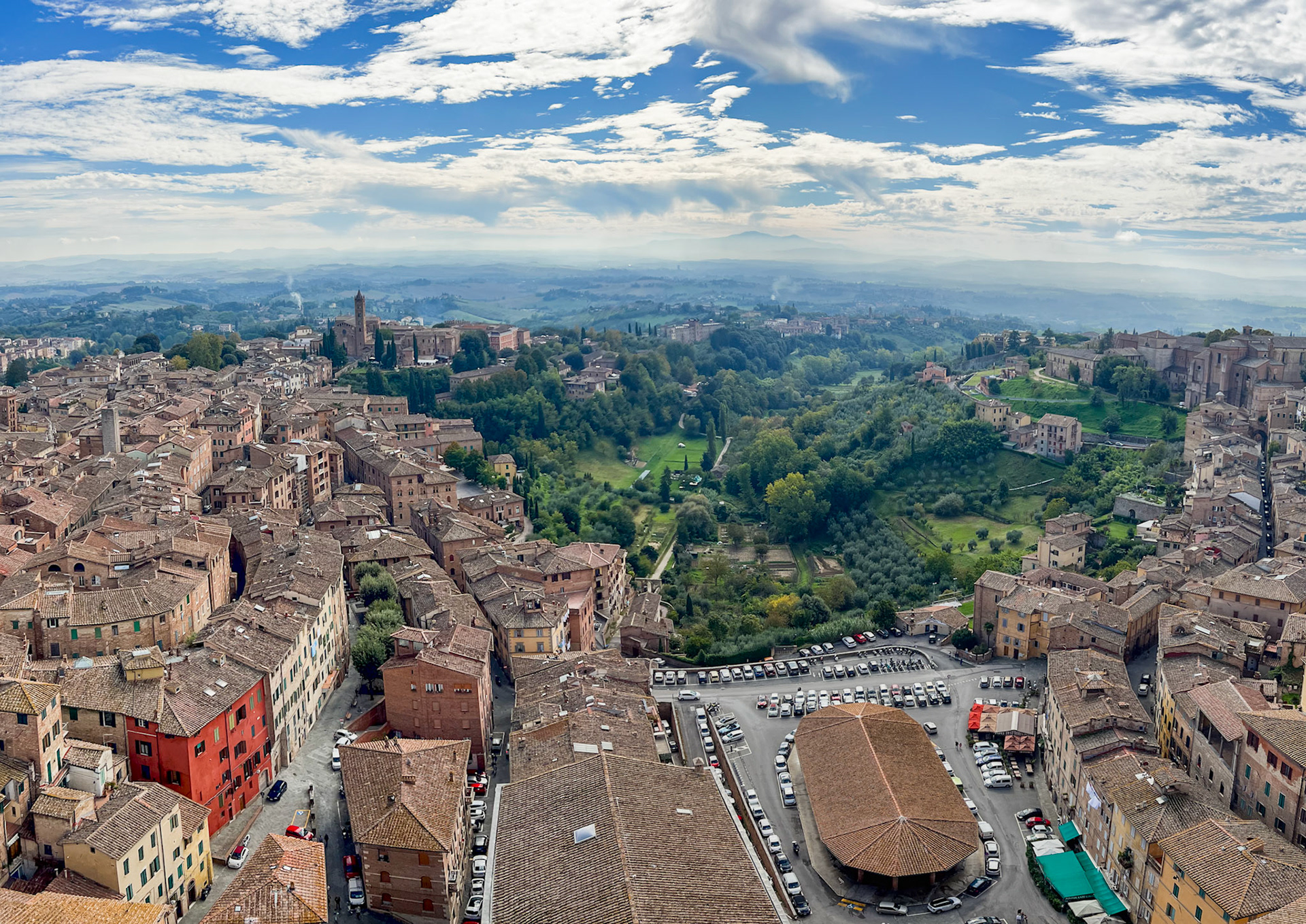 Siena roofs and the countryside from the top of Torre del Mangia, across Orto dei Pecci