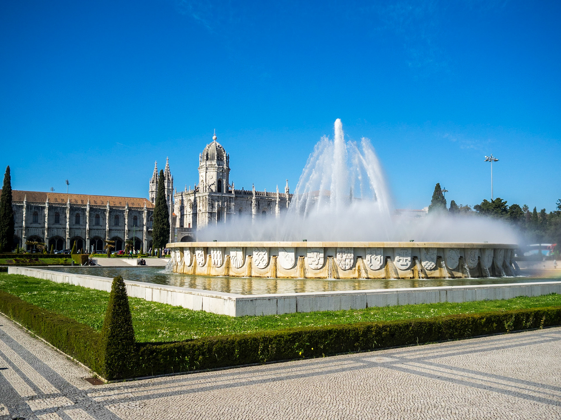 Fountain and gardens in Belem with Jeronimos Monastery in background