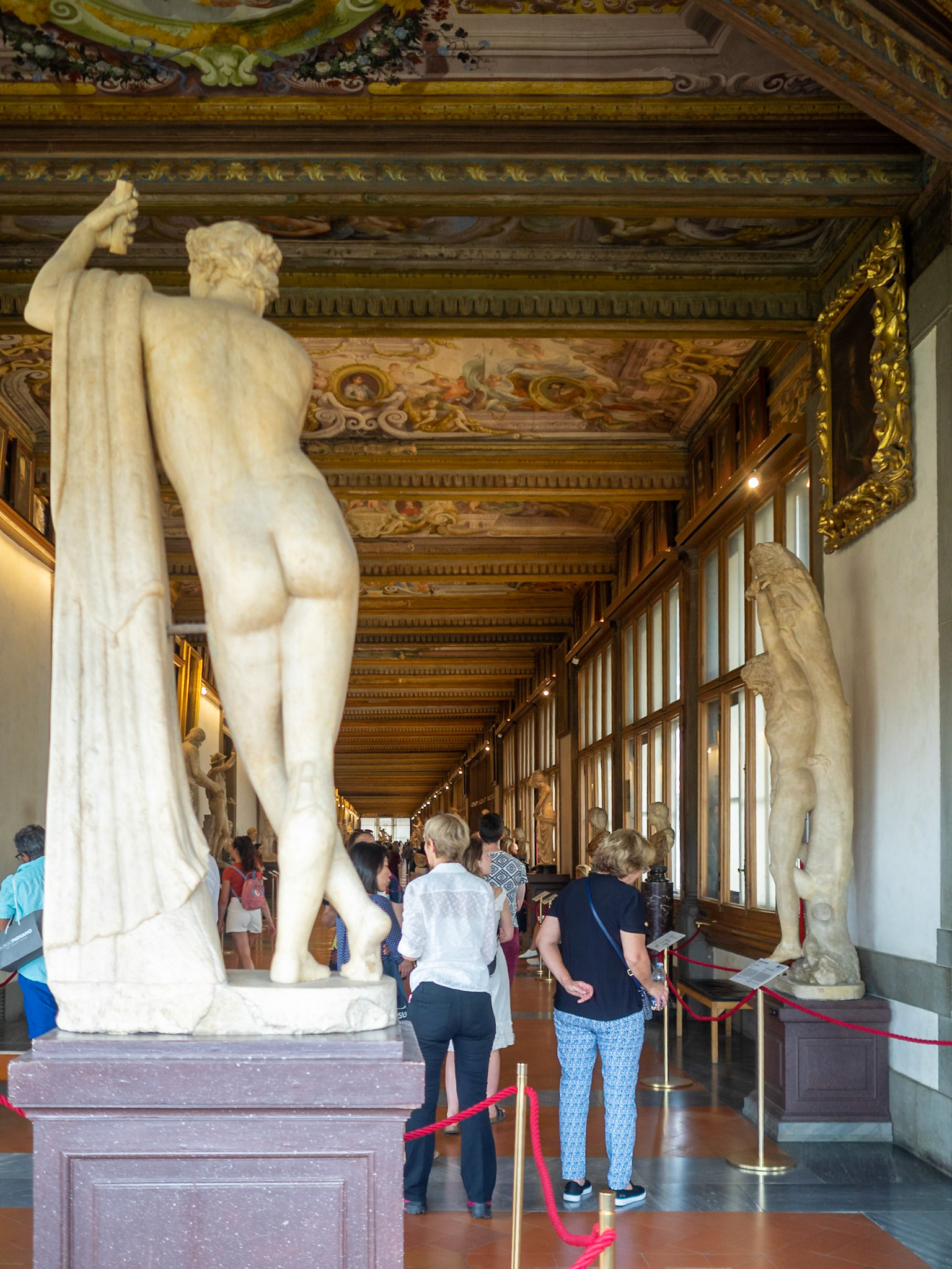 Visitors admiring the art works at the Uffizi Galleries