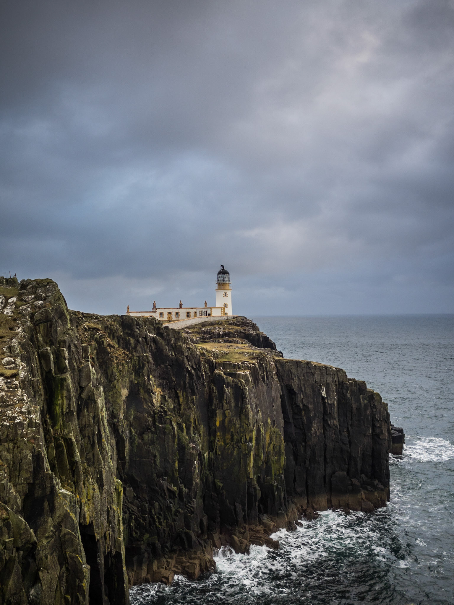 Neist Point lighthouse on top of the cliffs