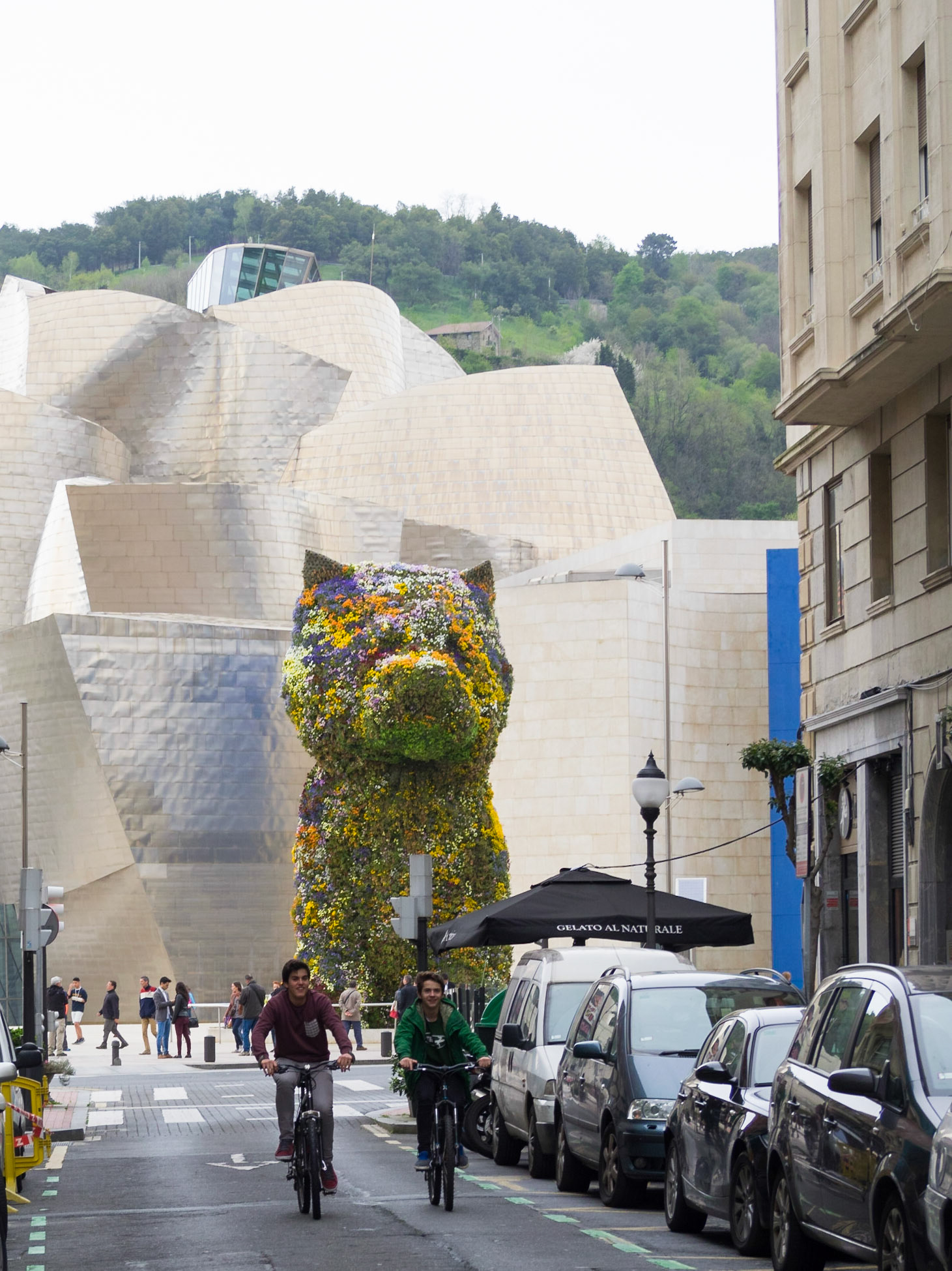 Jeff Koons Puppy flower sculpture at the end of a street in Bilbao
