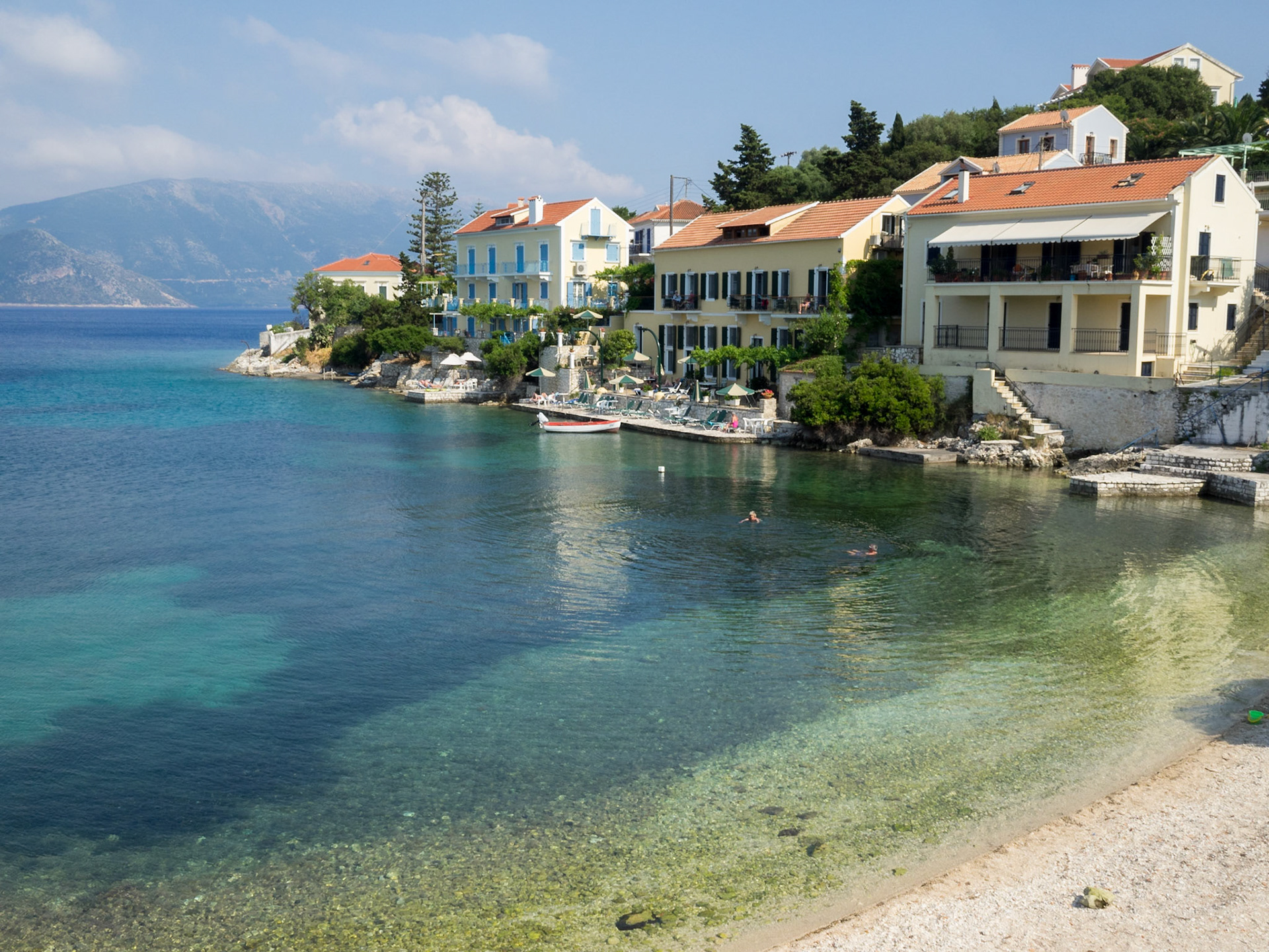Houses by the turquoise waters of Fiskardo bay