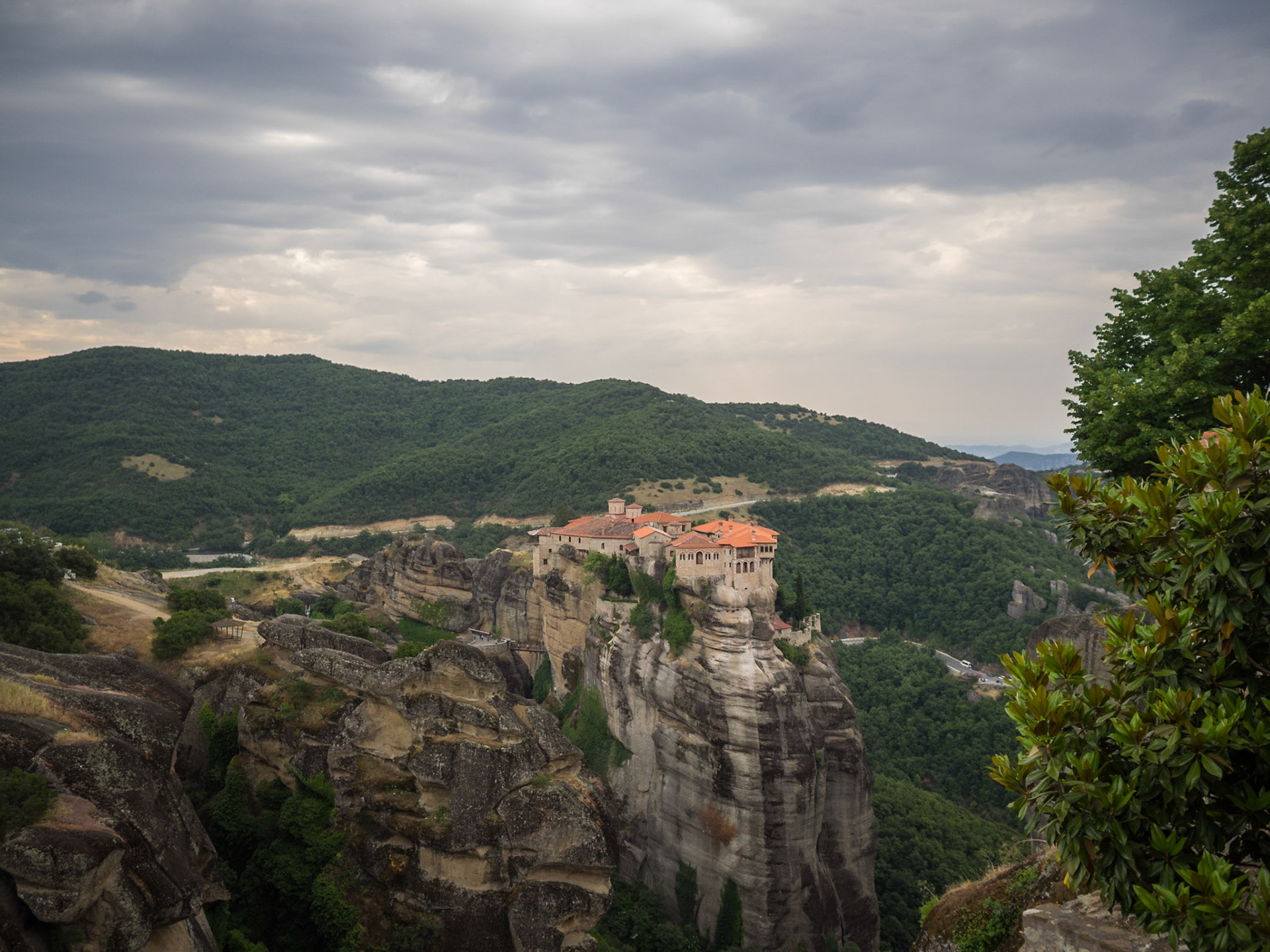 View of Meteora mountains and Moni Vaarlam Monastery atopp the rocks