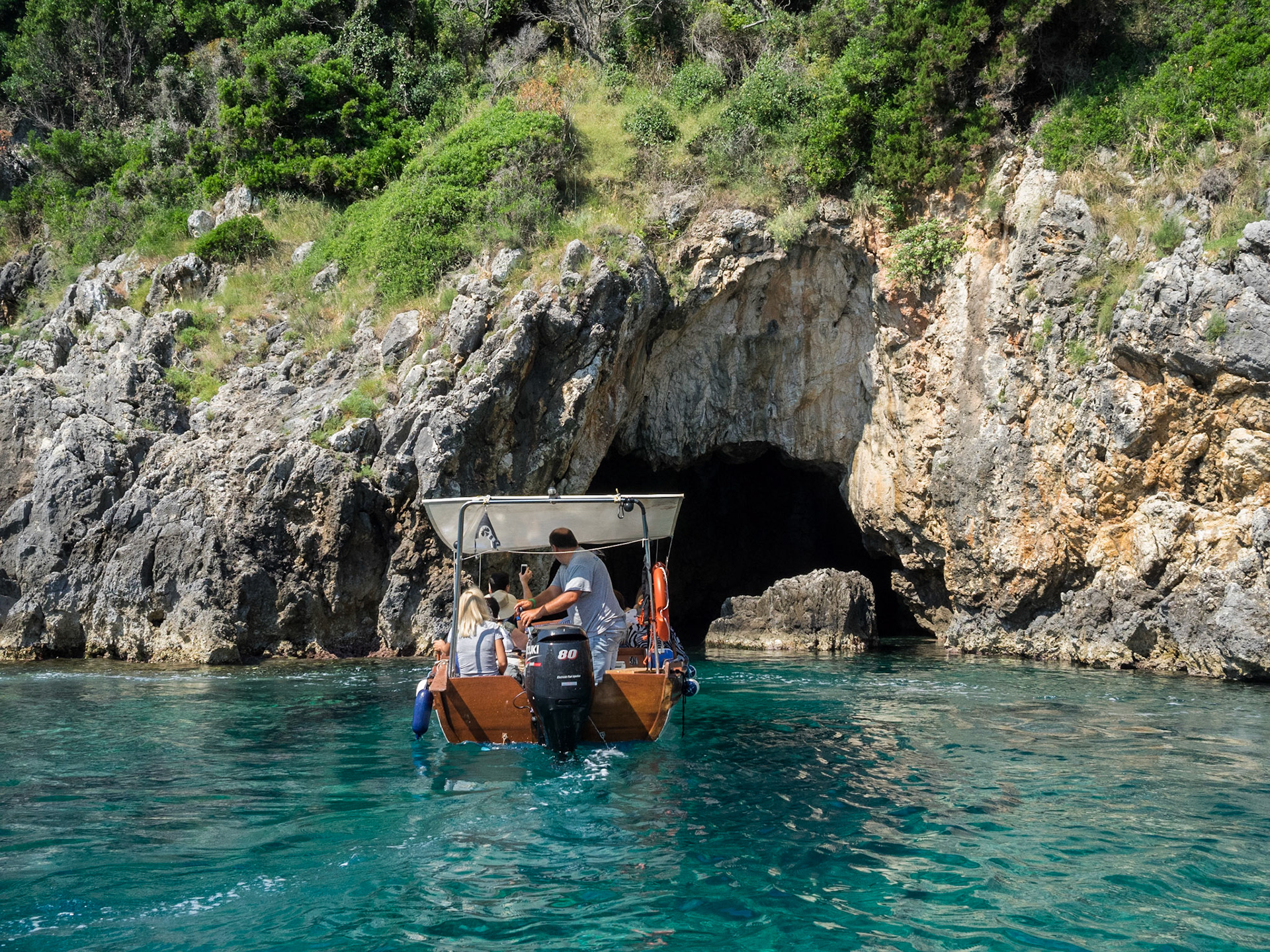 Tourists exploring the caves around Paliokastritsa  by boat