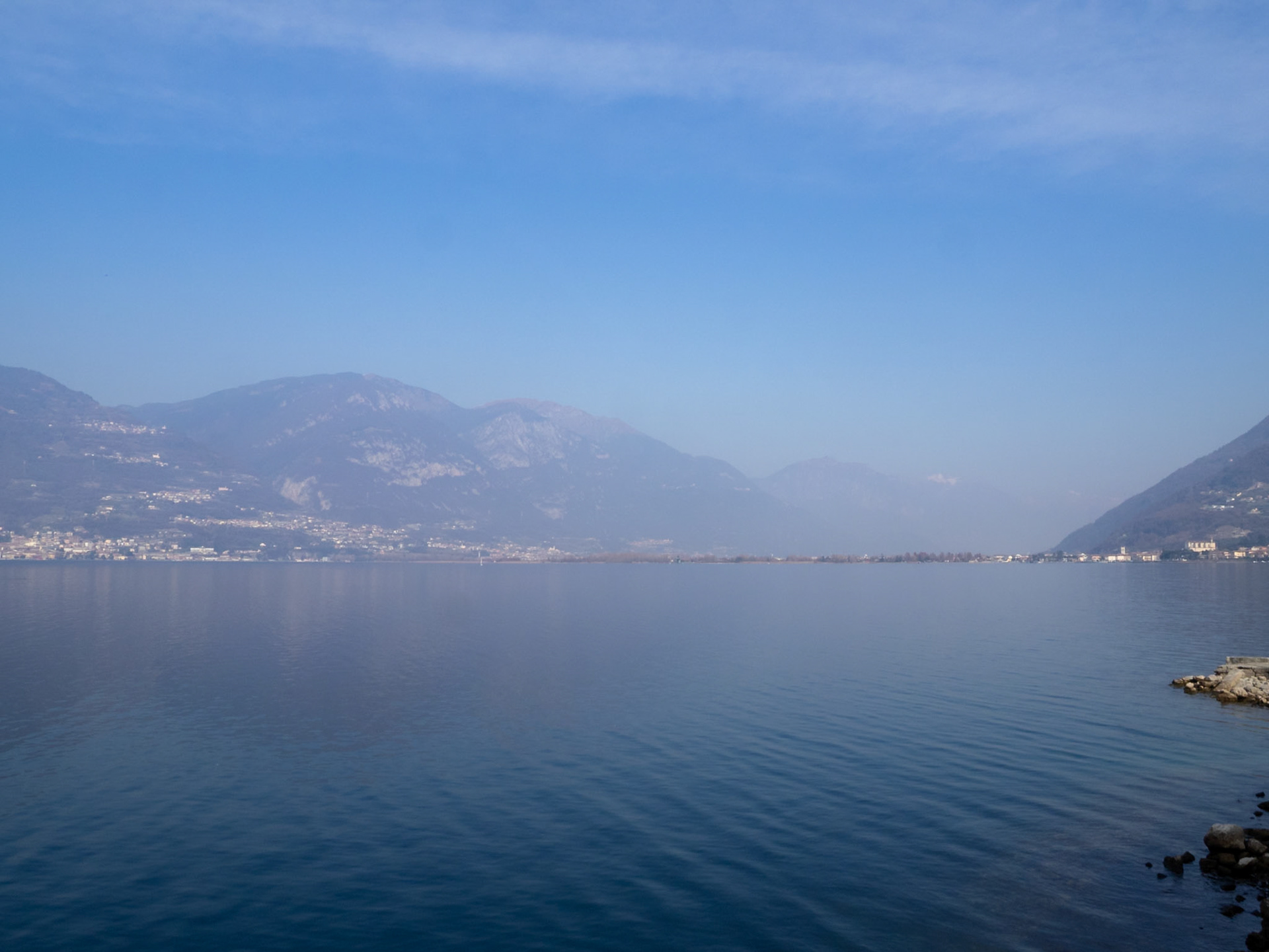 Lake Iseo in a sunny winter day with mist