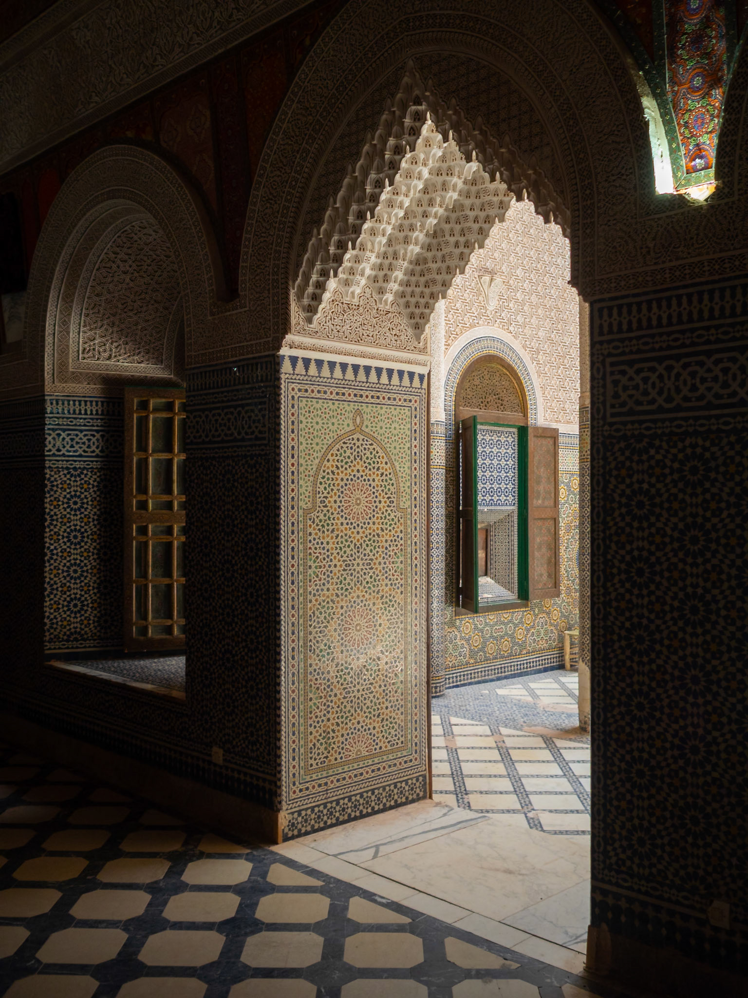 Telouet Kasbah room doorway framed by islamic stucco work, Morcocco