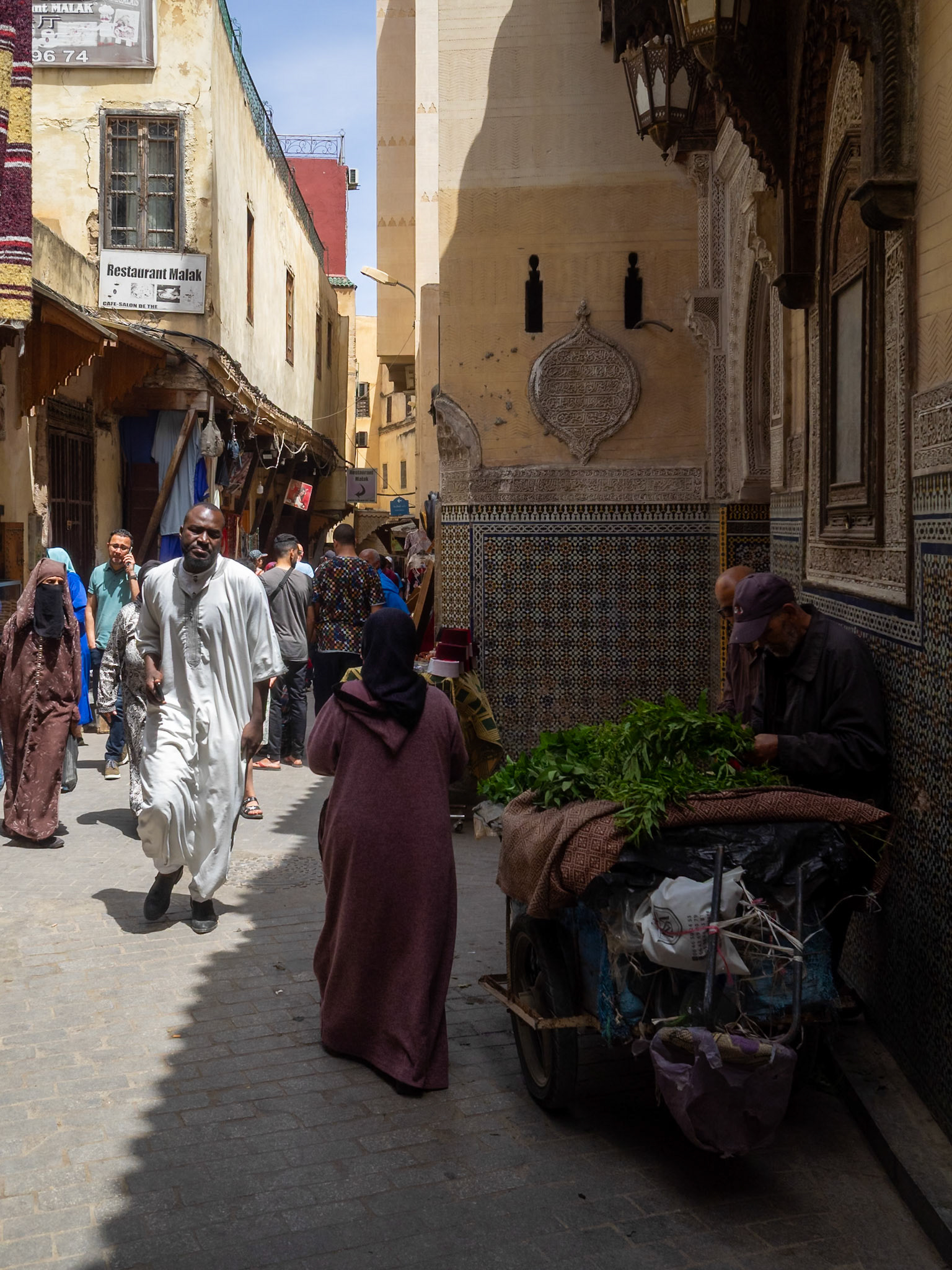 Pedestrians in Fez medina street, Morocco