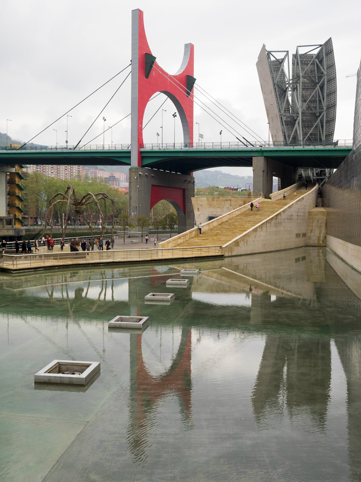 La Salve Bridge reflected in the water mirror of the Guggenheim Museum Bilbao