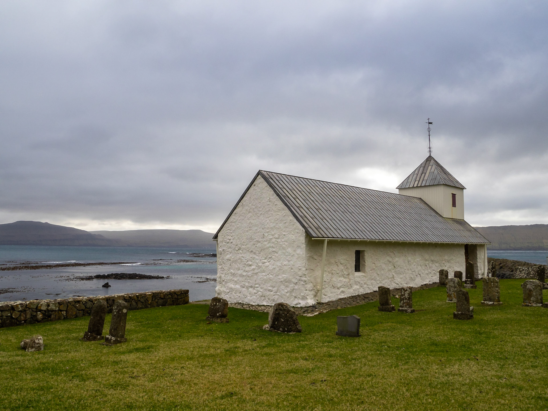 12th Century Ólavskirkjan church and graveyard, the oldest church in use in the Faroe Islands, Kirkjubøur